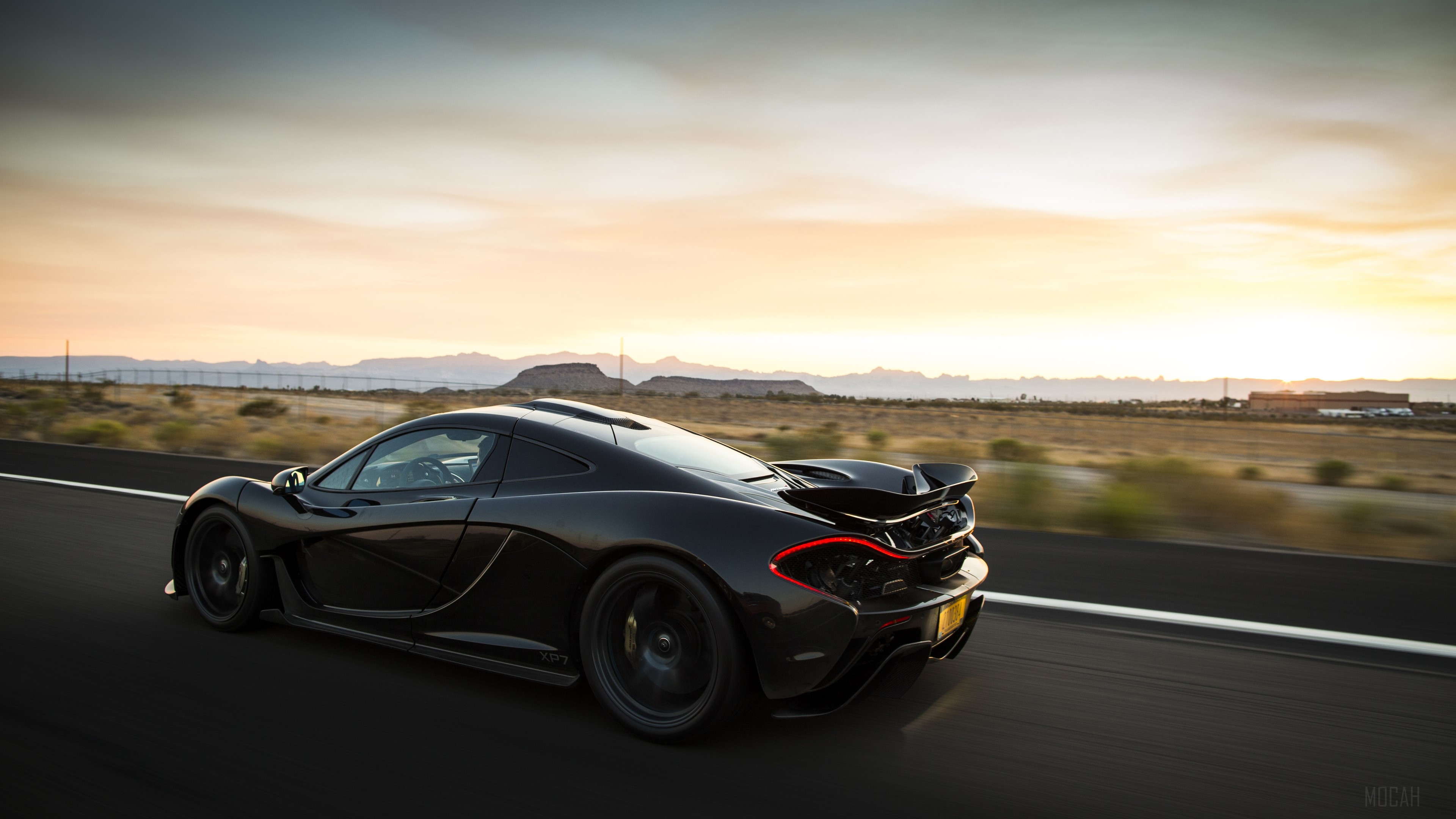 Black McLaren P1 XP7 Driving on Road HD Wallpaper