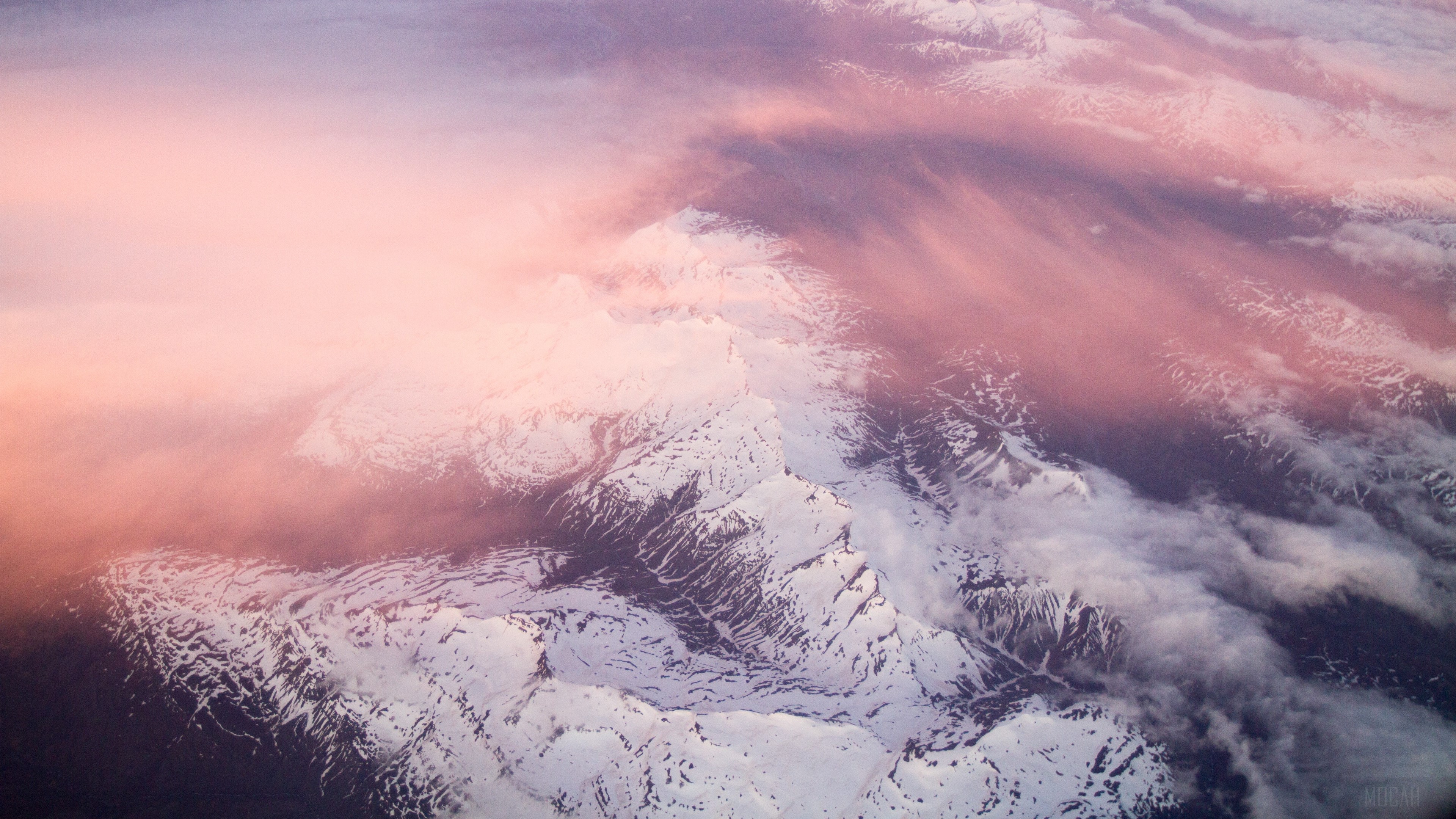 Snow-capped mountains under pink clouds HD Wallpaper