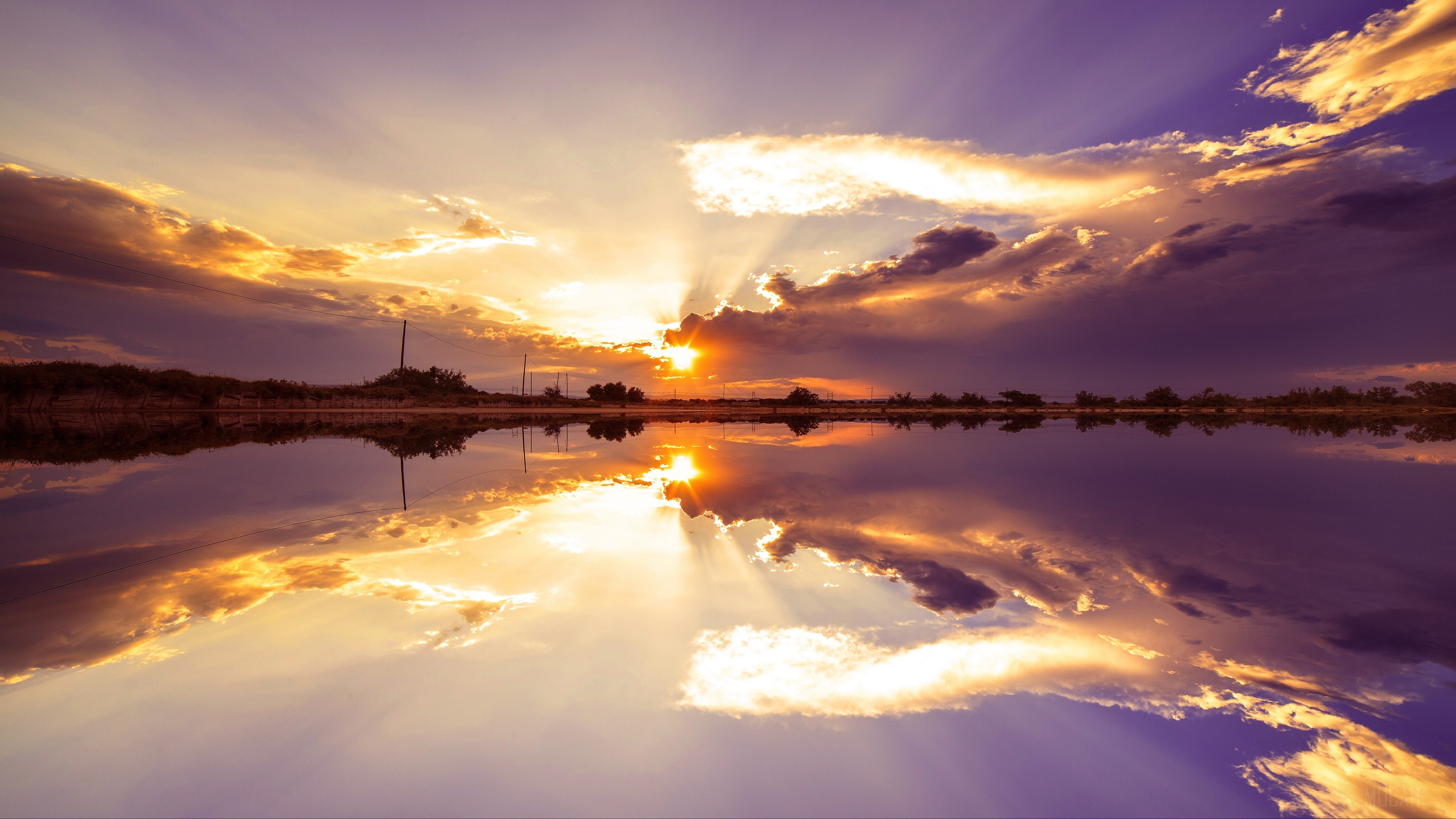 Sunset over lake with dramatic clouds and reflection HD Wallpaper