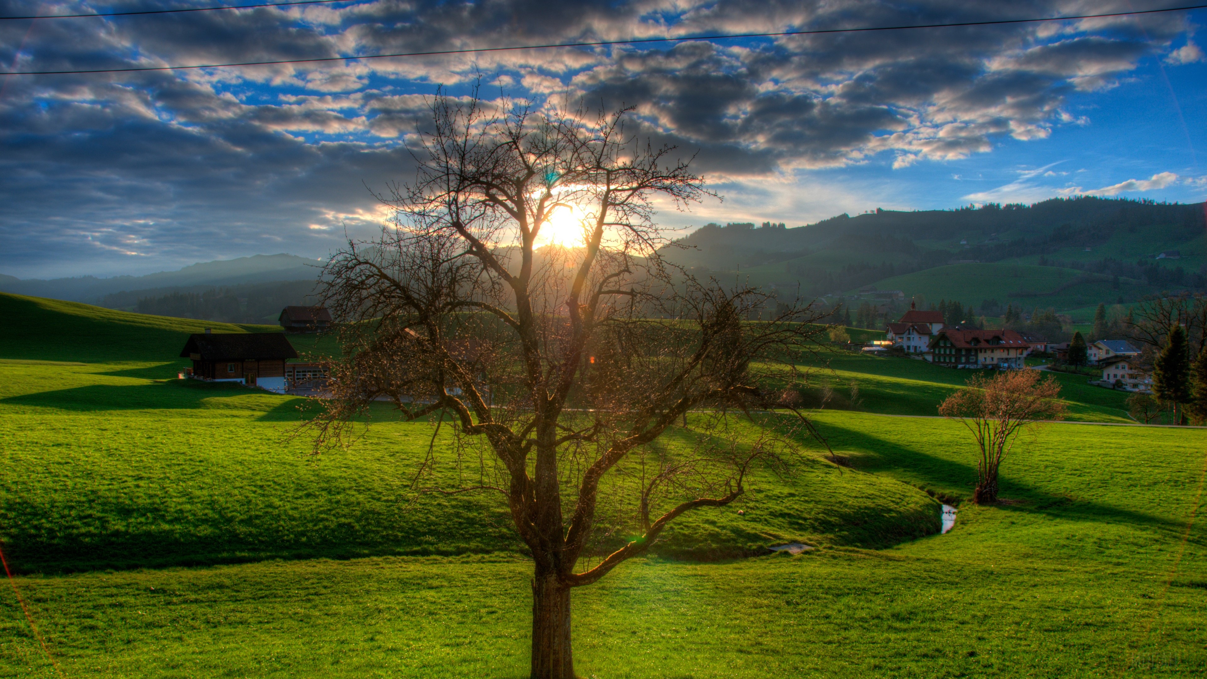 Sunset Over Green Fields with Stream HD Wallpaper