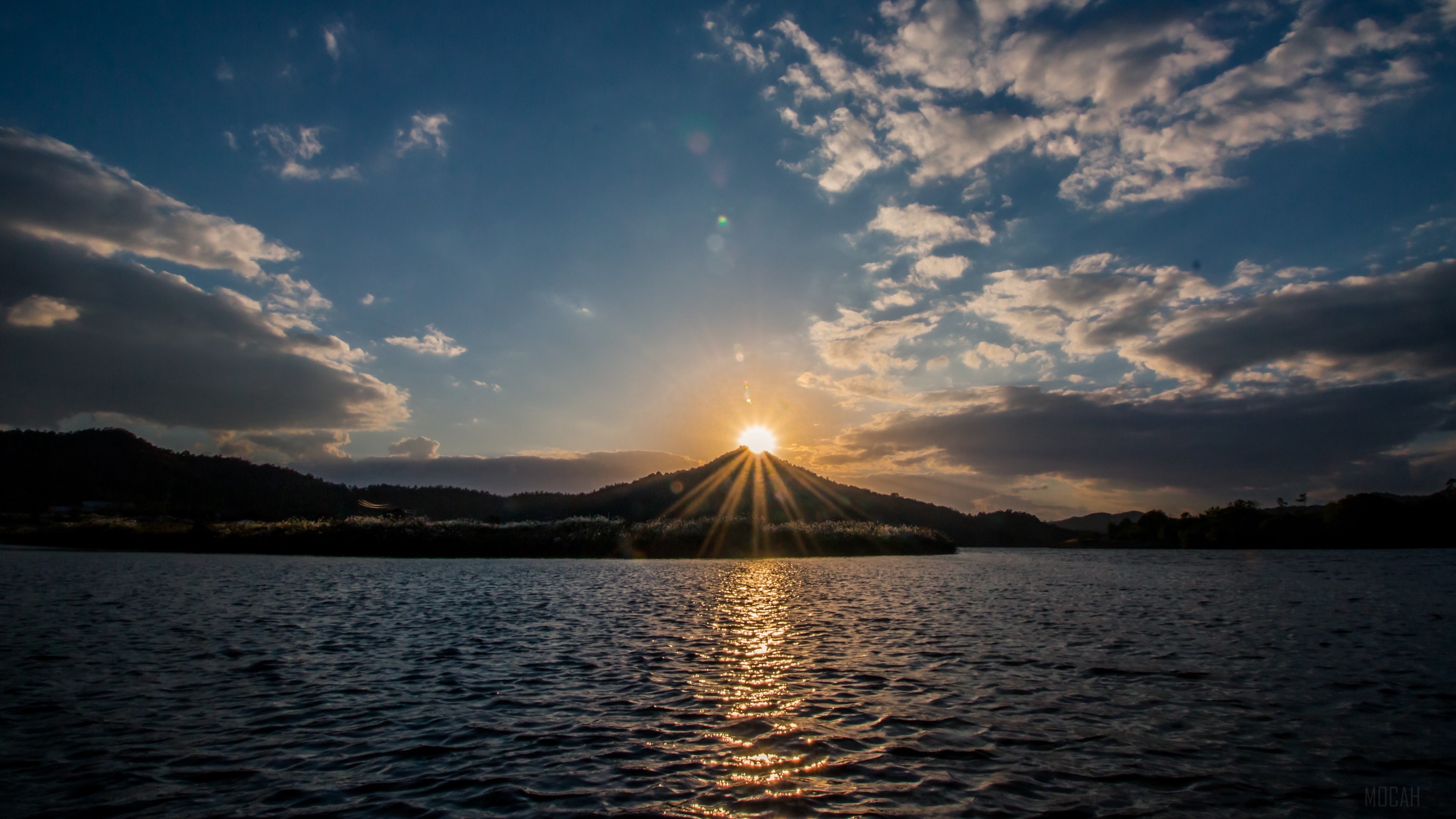 Sunset over a lake with mountains and clouds 4K HD Wallpaper