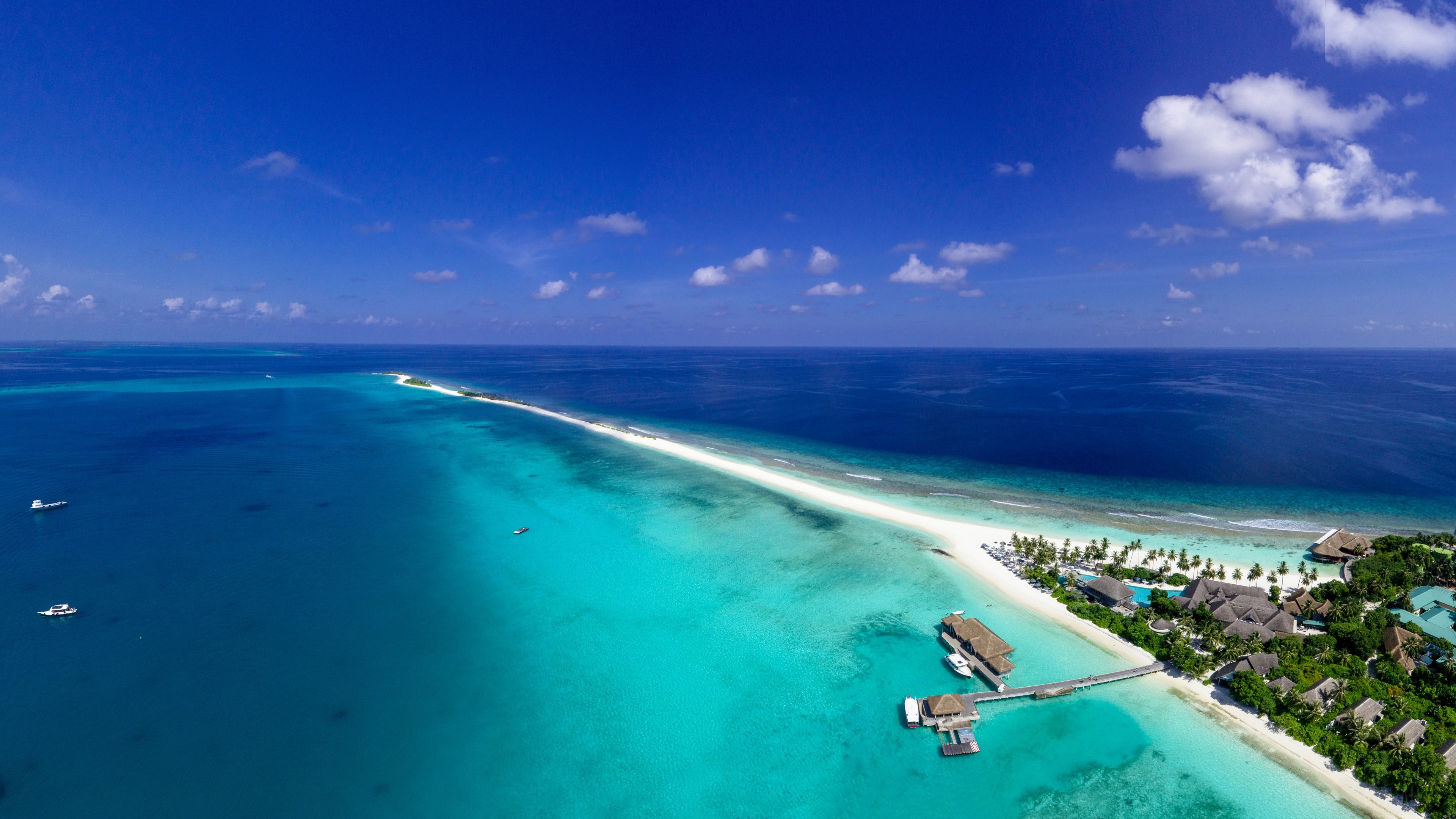 Aerial view of a tropical island resort in the ocean HD Wallpaper