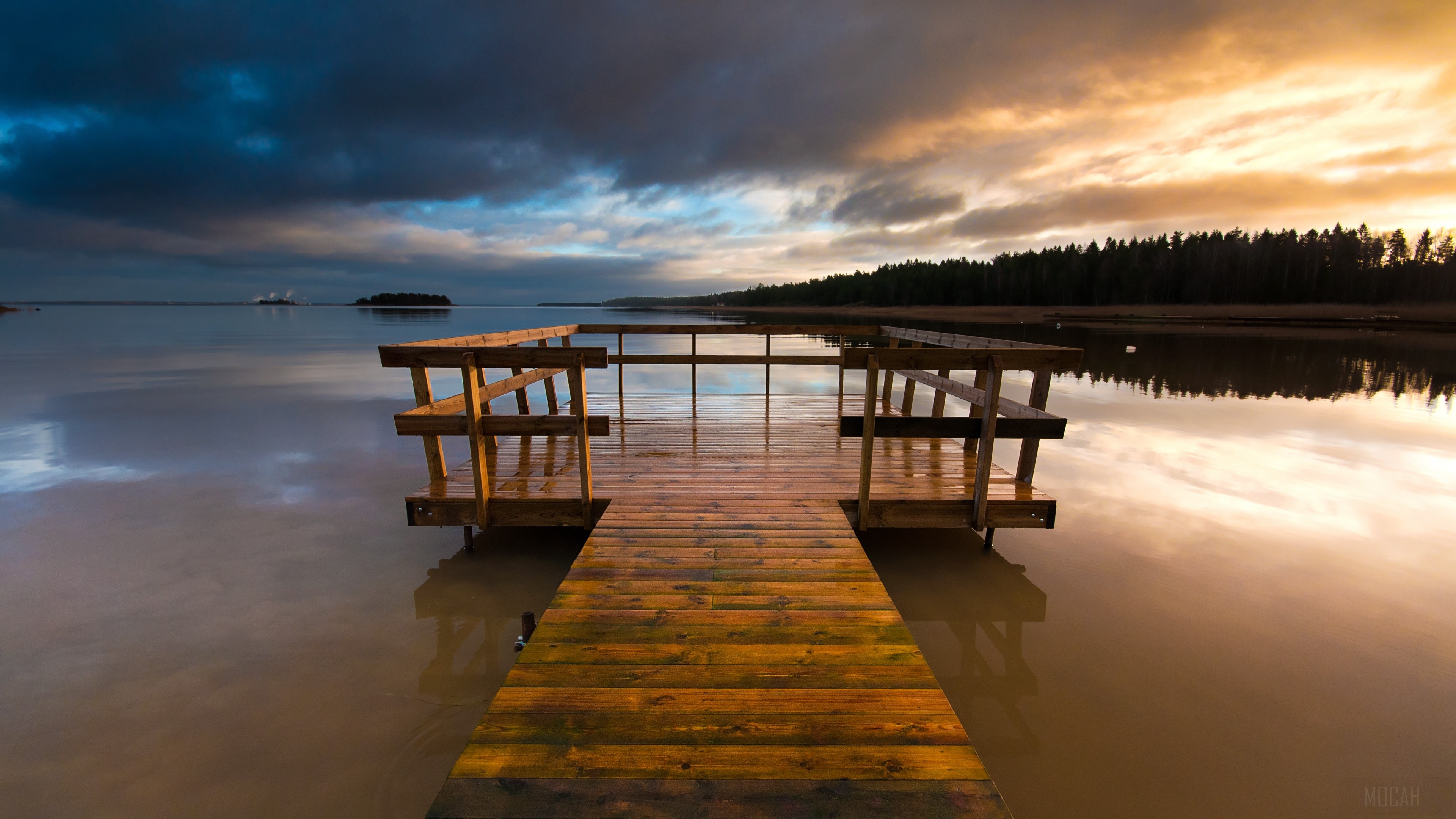 Wooden pier on a lake at sunset with dramatic clouds HD Wallpaper
