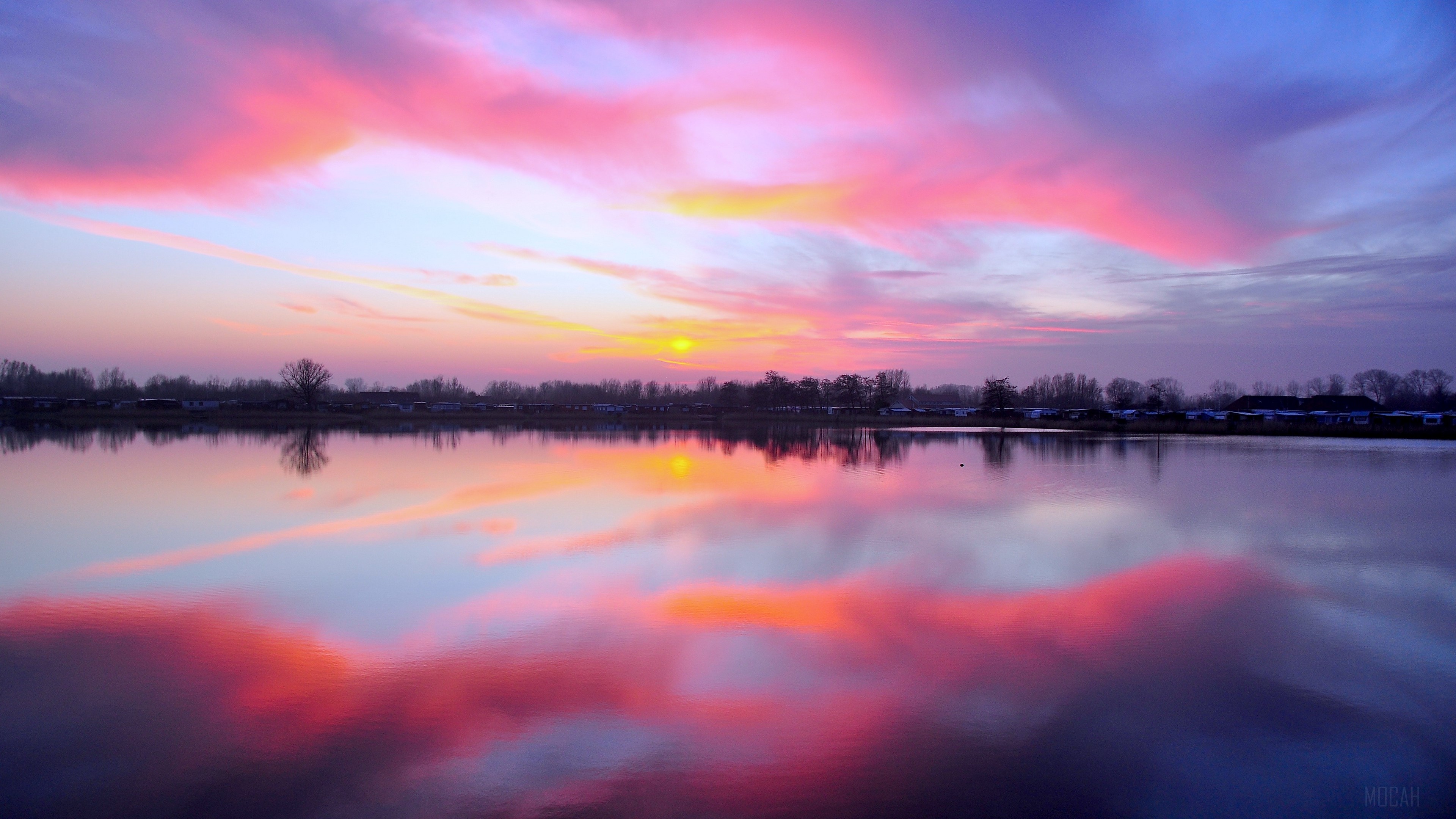 Sunset over a lake with colorful clouds and reflections 4K HD Wallpaper