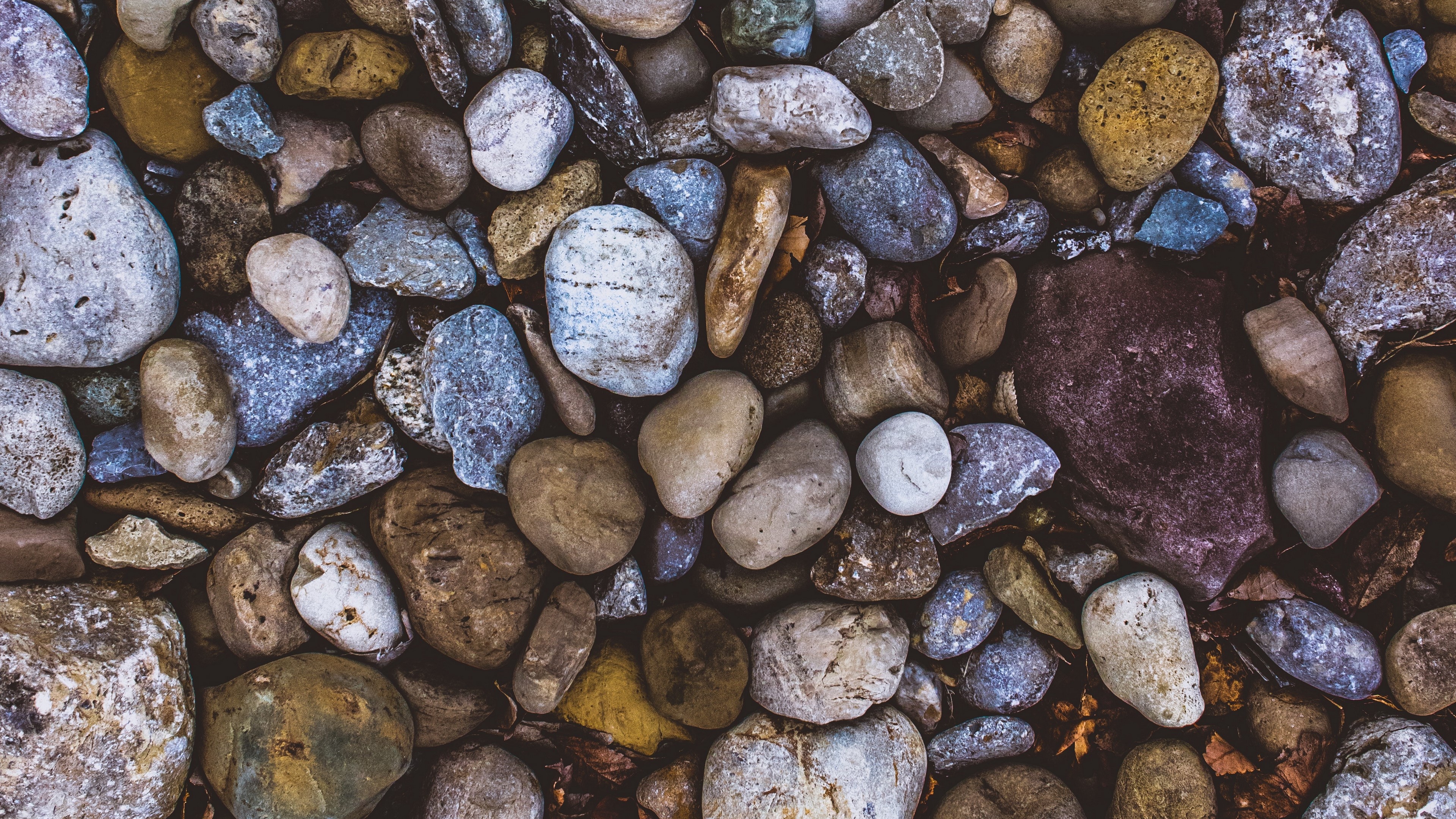 Close-up of various colored pebbles and stones HD Wallpaper