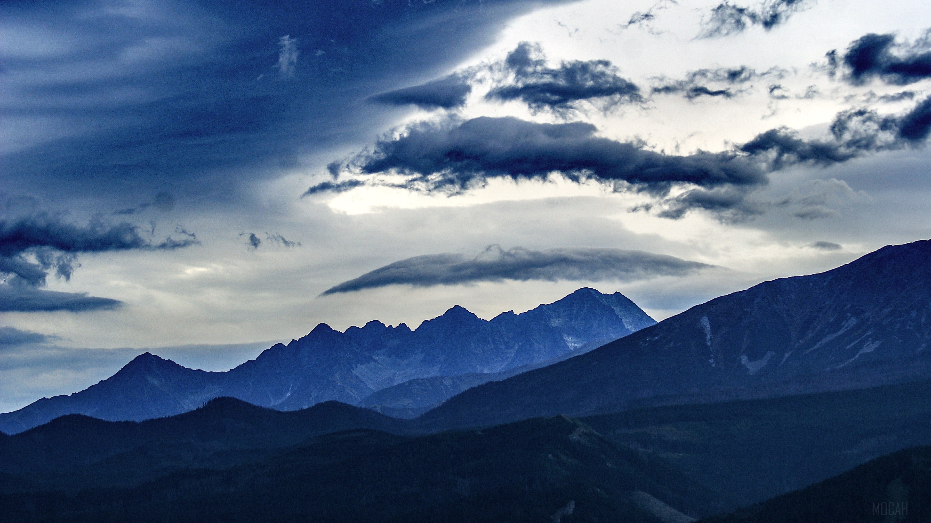Mountain range with dramatic clouds 4K HD Wallpaper