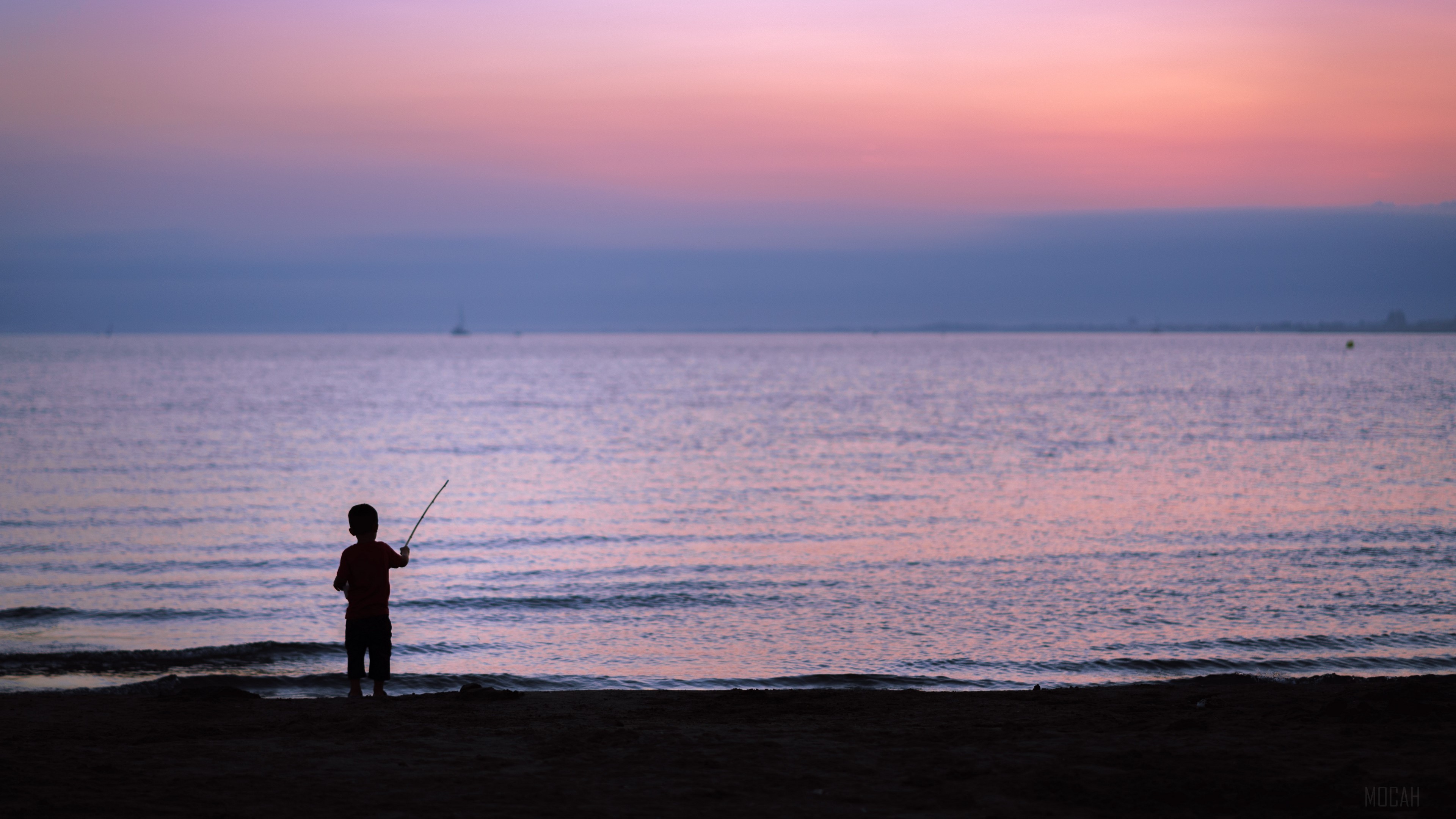 Child silhouette fishing at sunset on the sea 4K HD Wallpaper