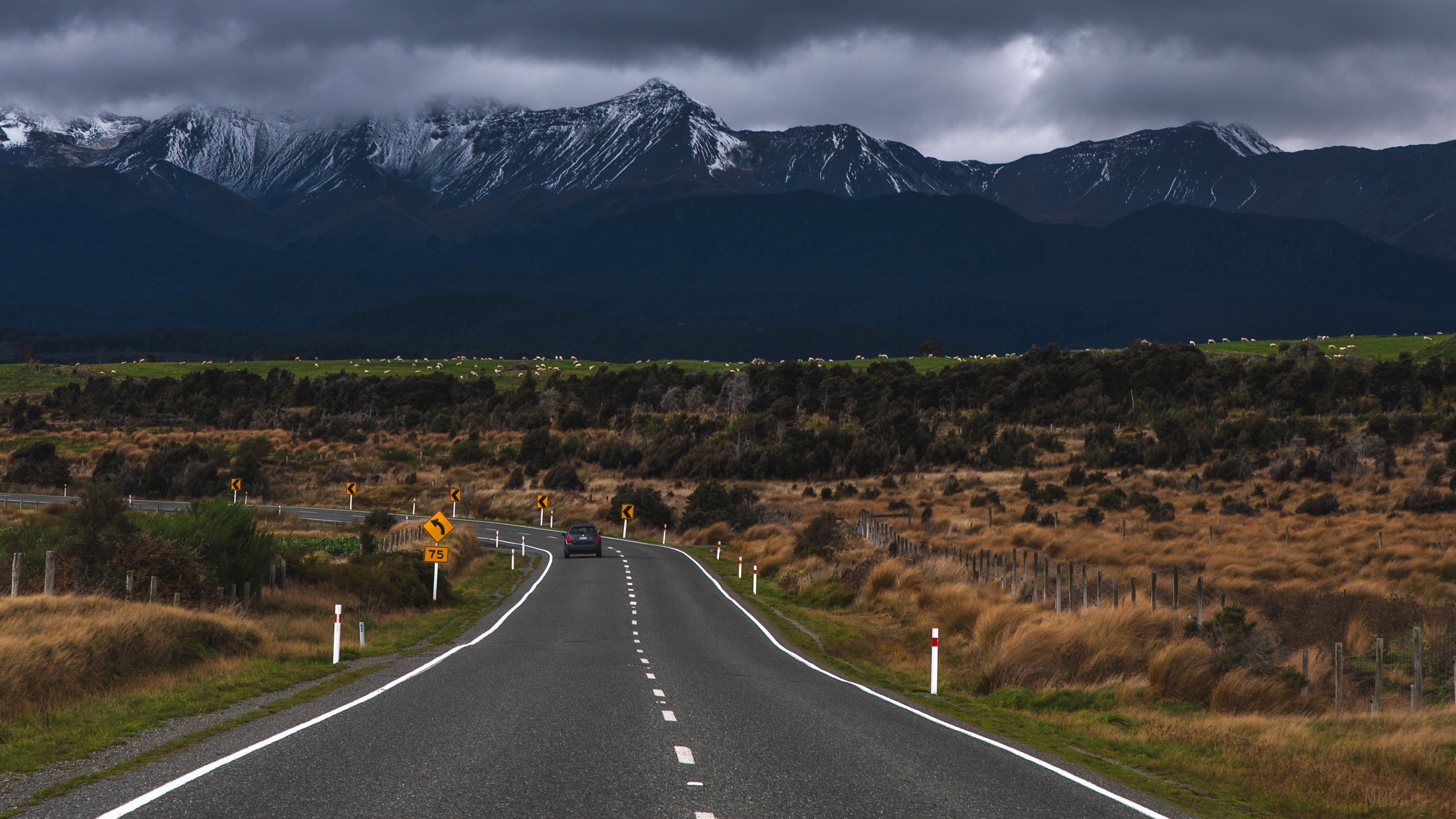 Road leading to snow-capped mountains in New Zealand 4K HD Wallpaper