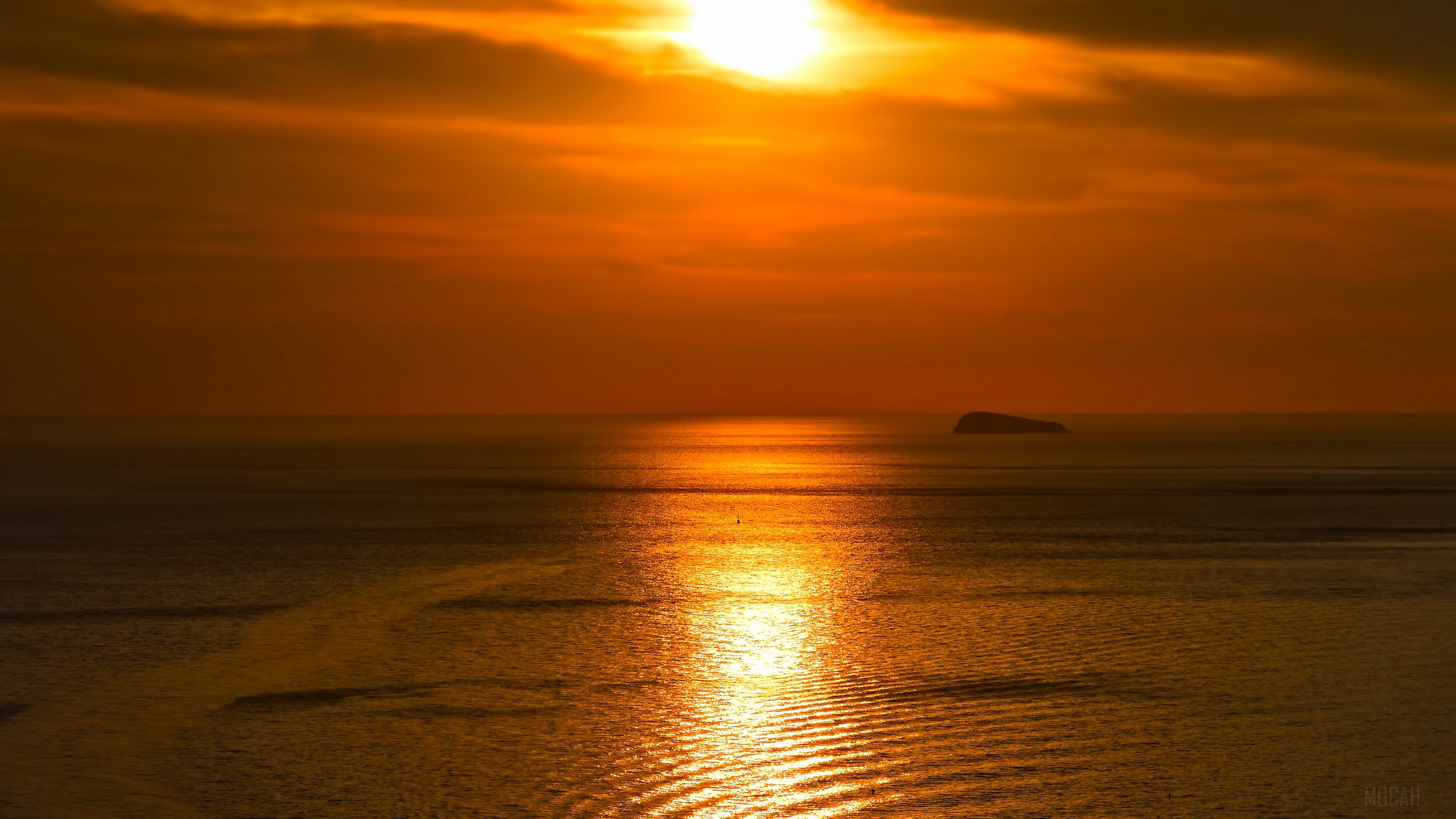 Sunset over the sea with island and waves 4K HD Wallpaper