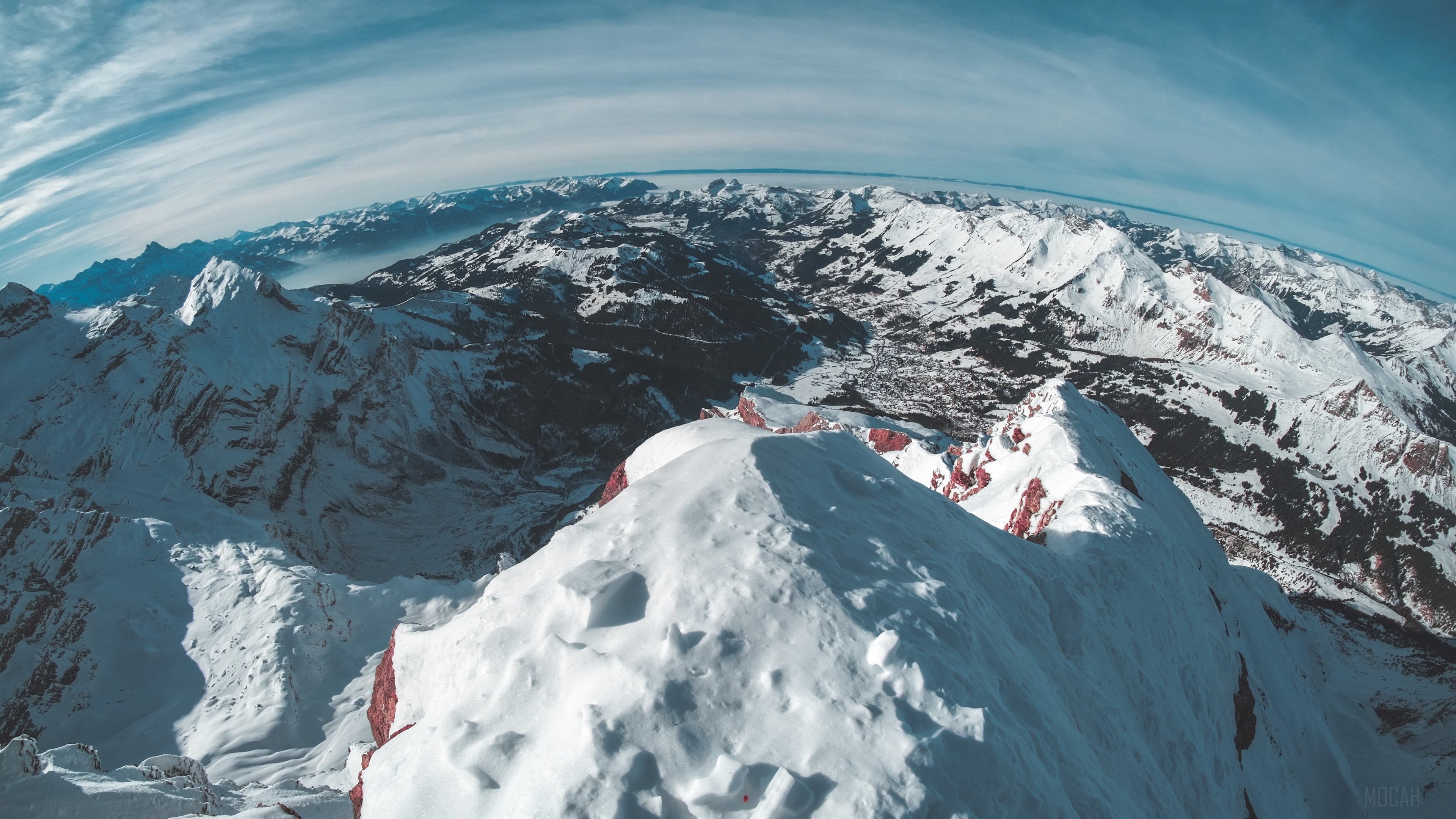 Snowy mountains and a village from a high vantage point 4K HD Wallpaper
