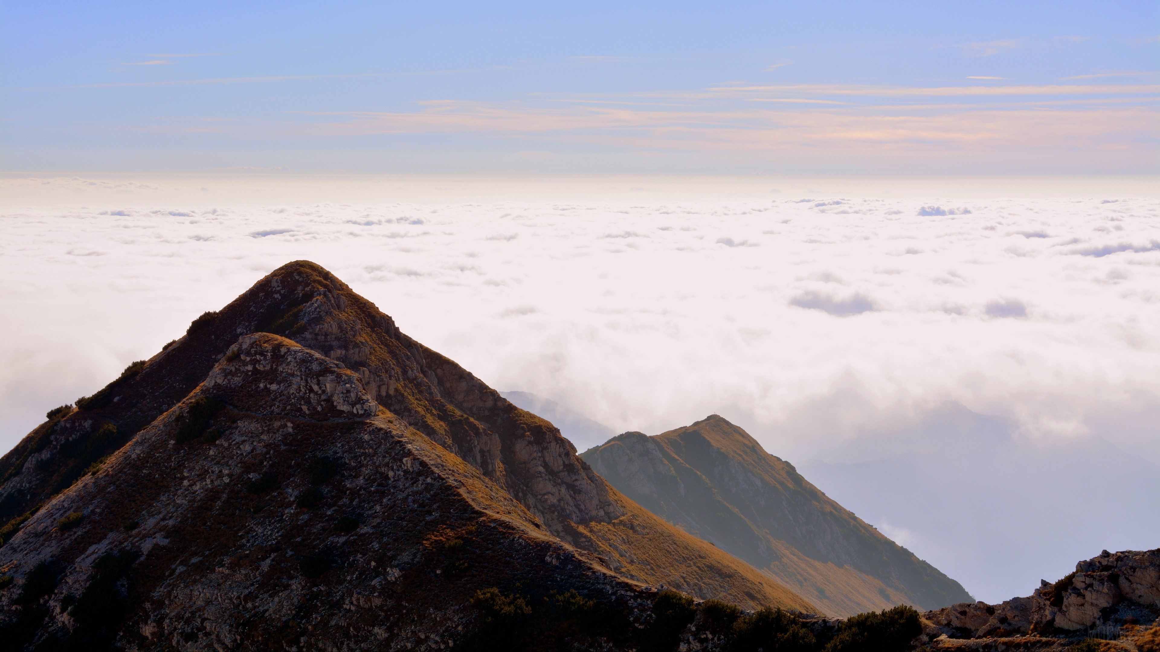 Mountain peaks above clouds in Carrega Ligure, Italy 4K HD Wallpaper