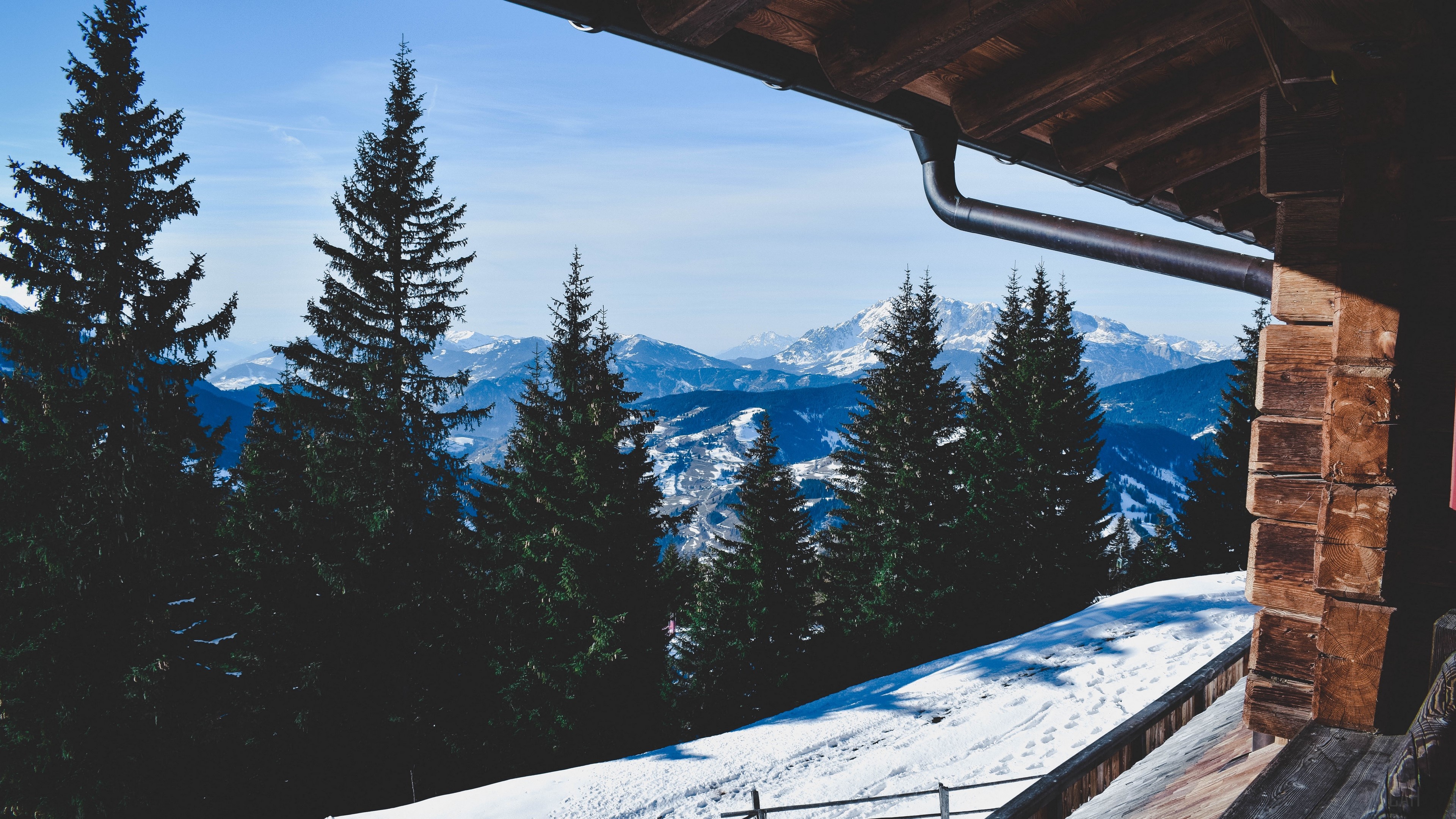 Winter mountain view from a wooden cabin HD Wallpaper