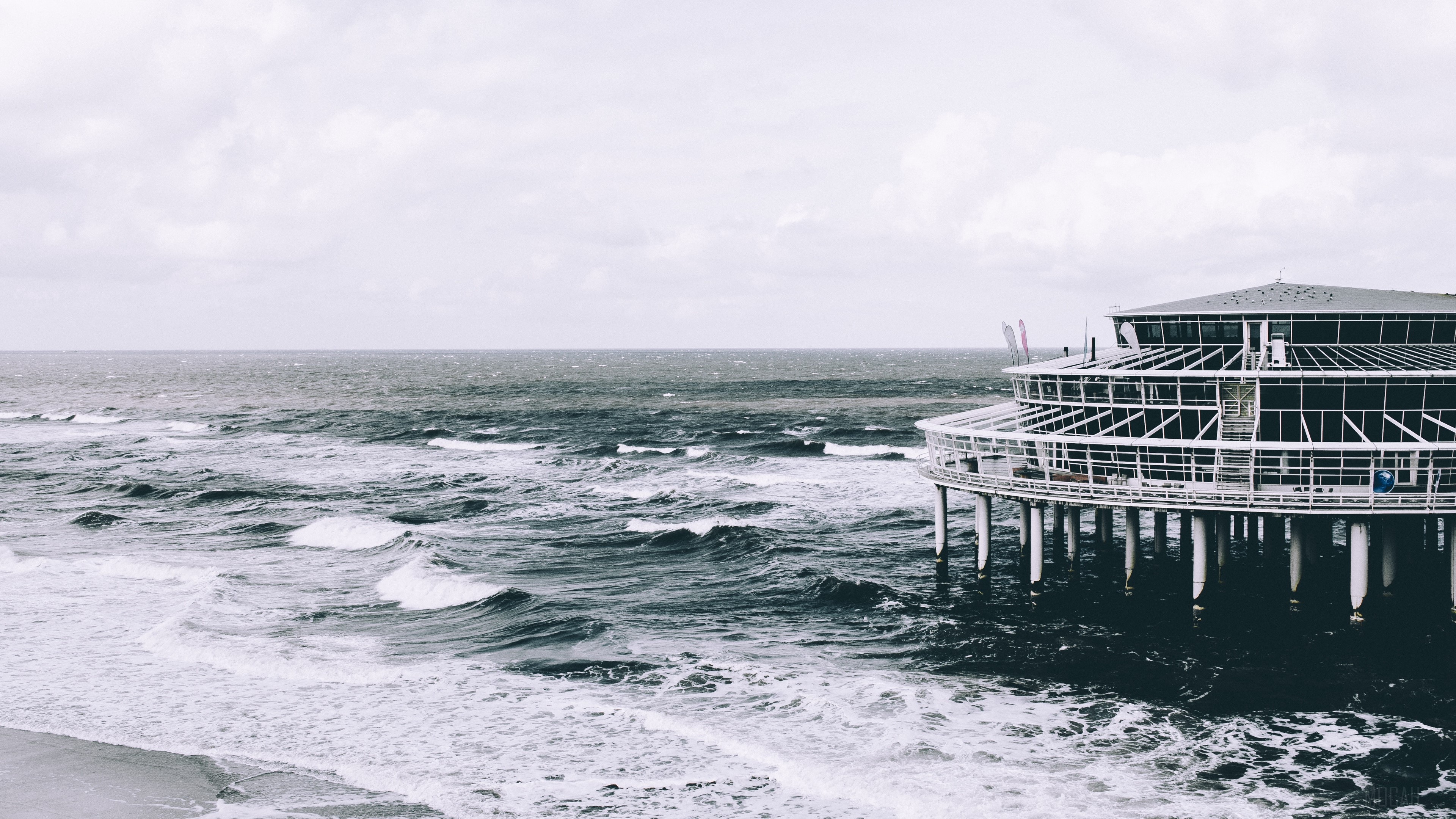 Pier structure over the sea with waves HD Wallpaper
