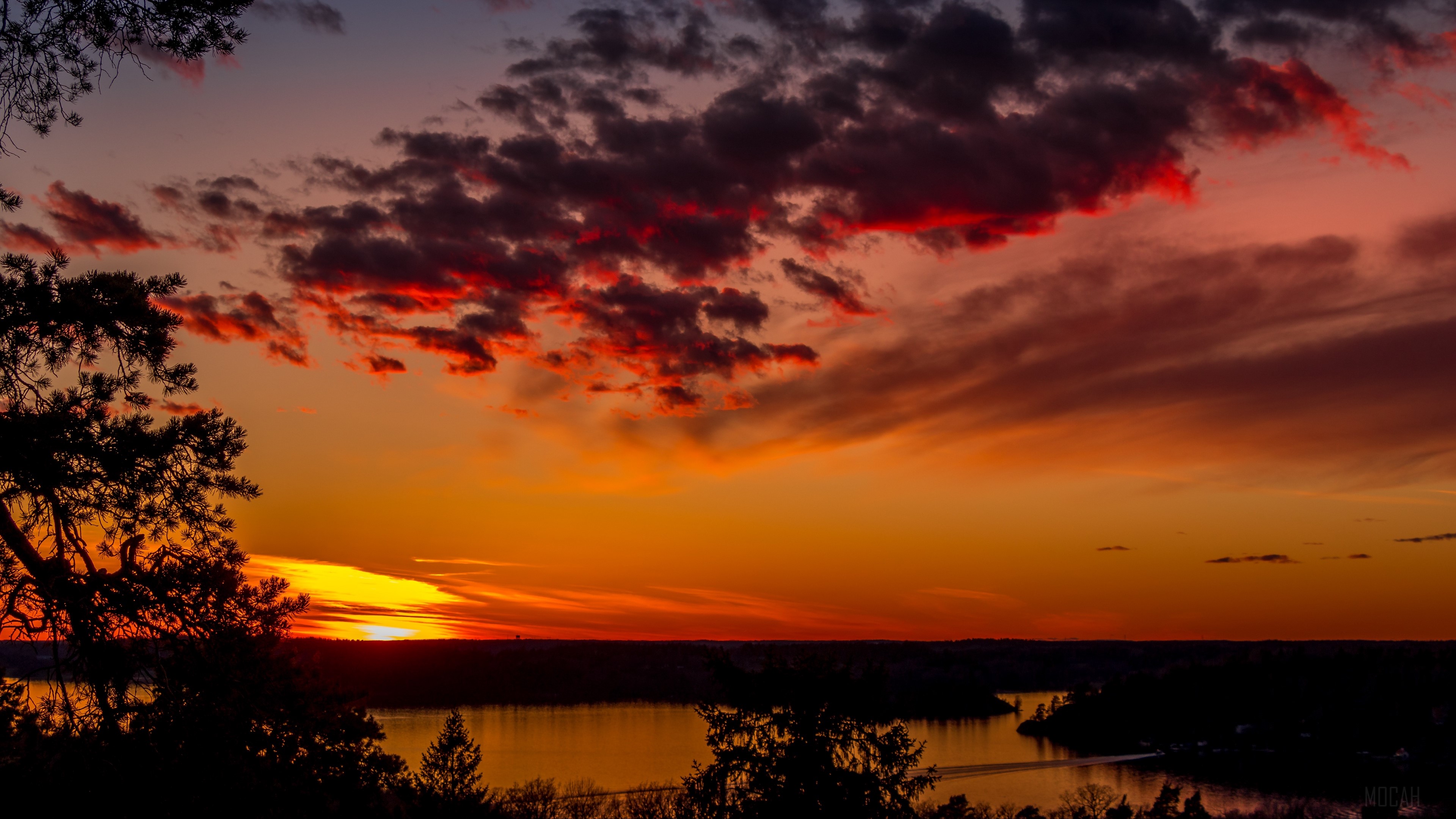 Sunset over lake with dramatic clouds and trees HD Wallpaper