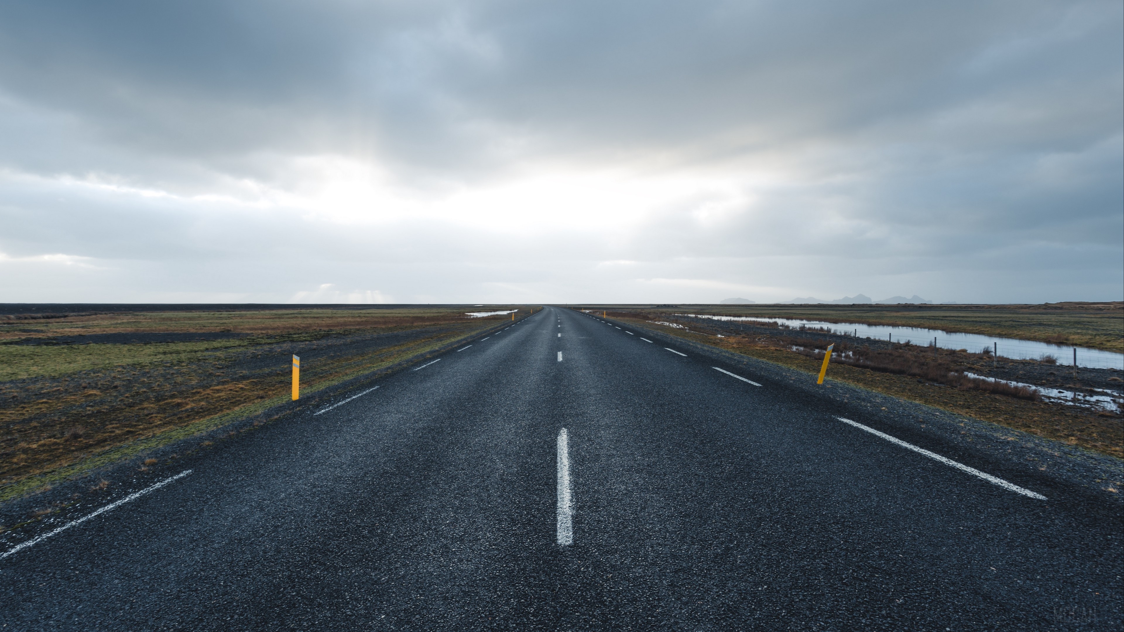 Empty Road Towards Horizon Under Cloudy Sky 4K HD Wallpaper