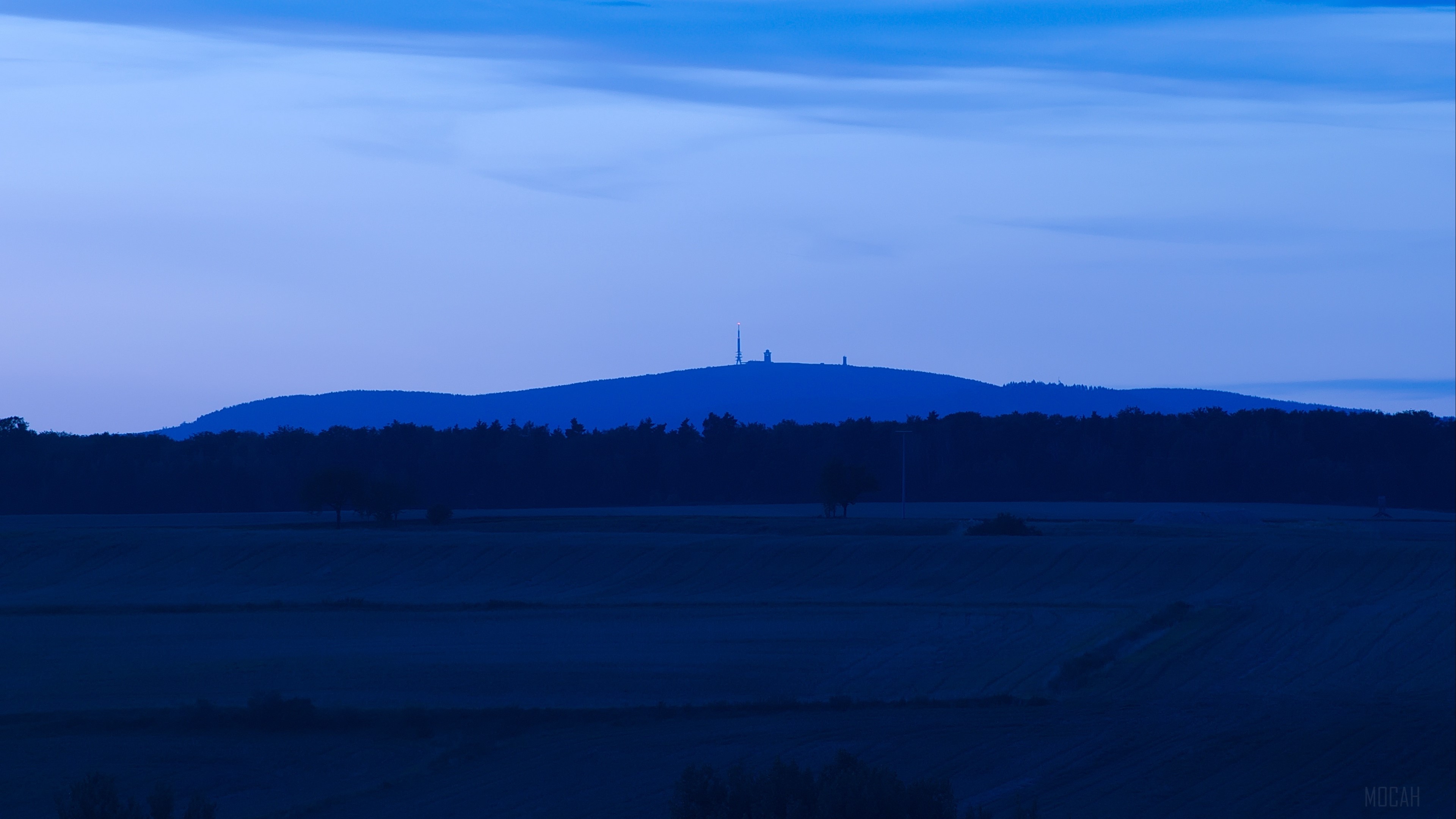 Blue evening landscape with distant mountain and radio towers HD Wallpaper