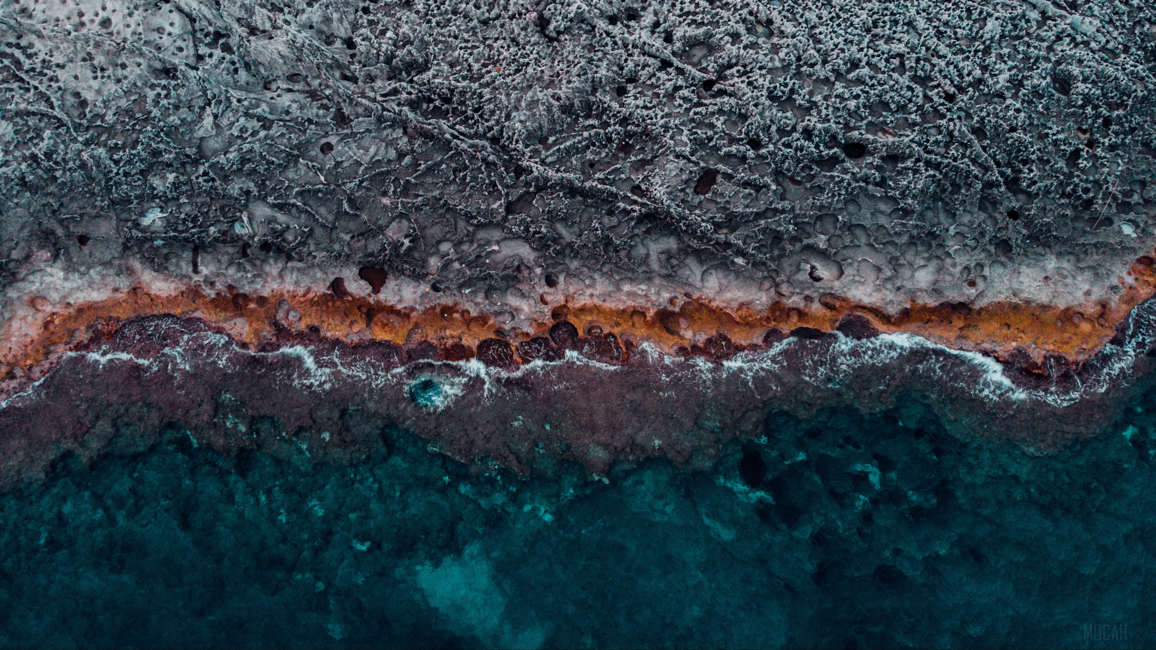 Aerial view of rocky coast with ocean waves HD Wallpaper