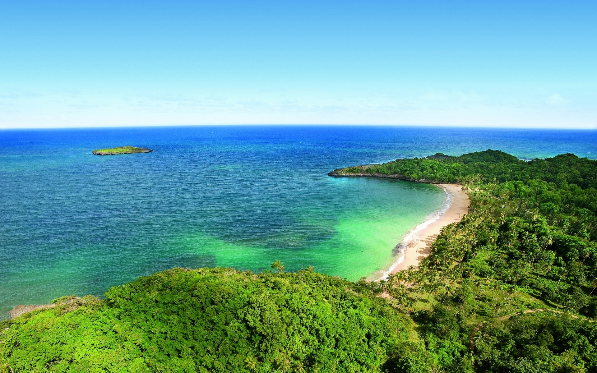 Tropical beach with turquoise water and green hills HD Wallpaper