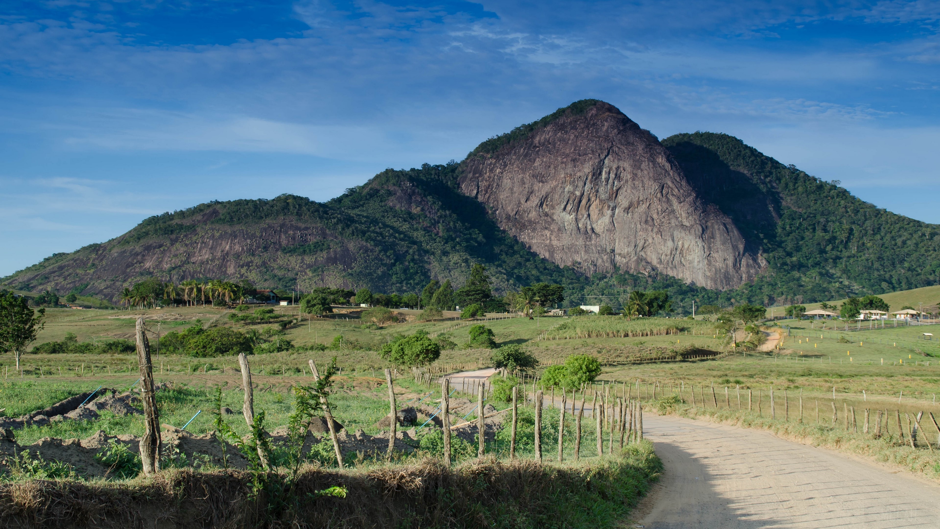 Mountain with a pathway and fence 4K HD Wallpaper