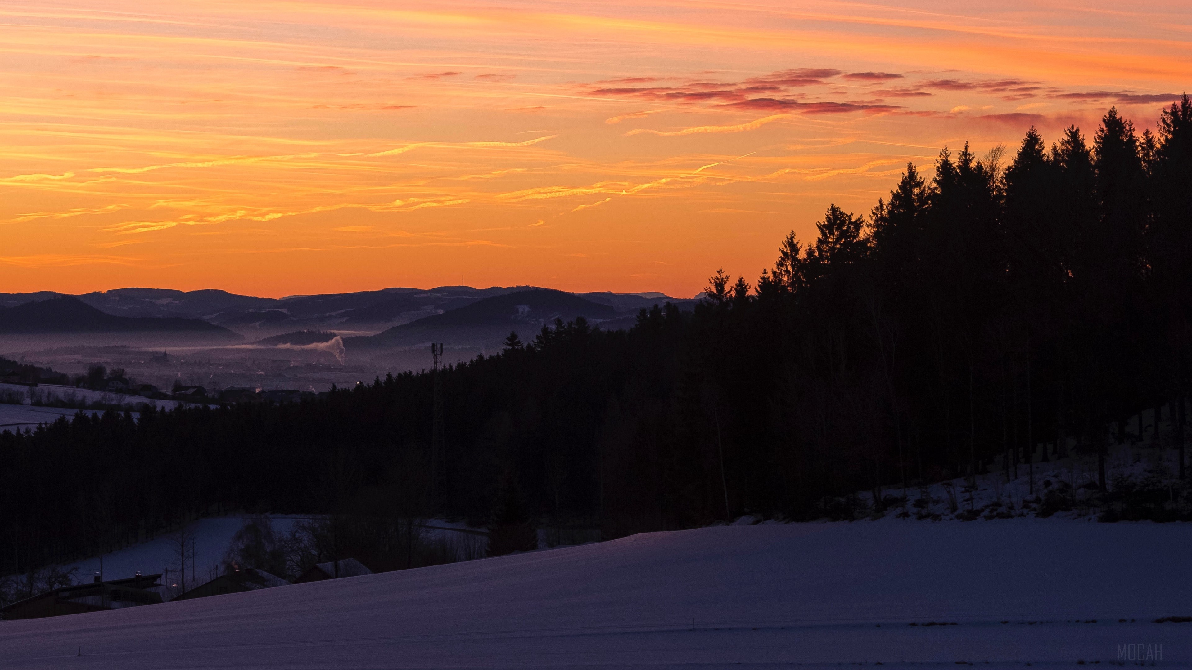 Sunset over snowy hills with forest and valley HD Wallpaper
