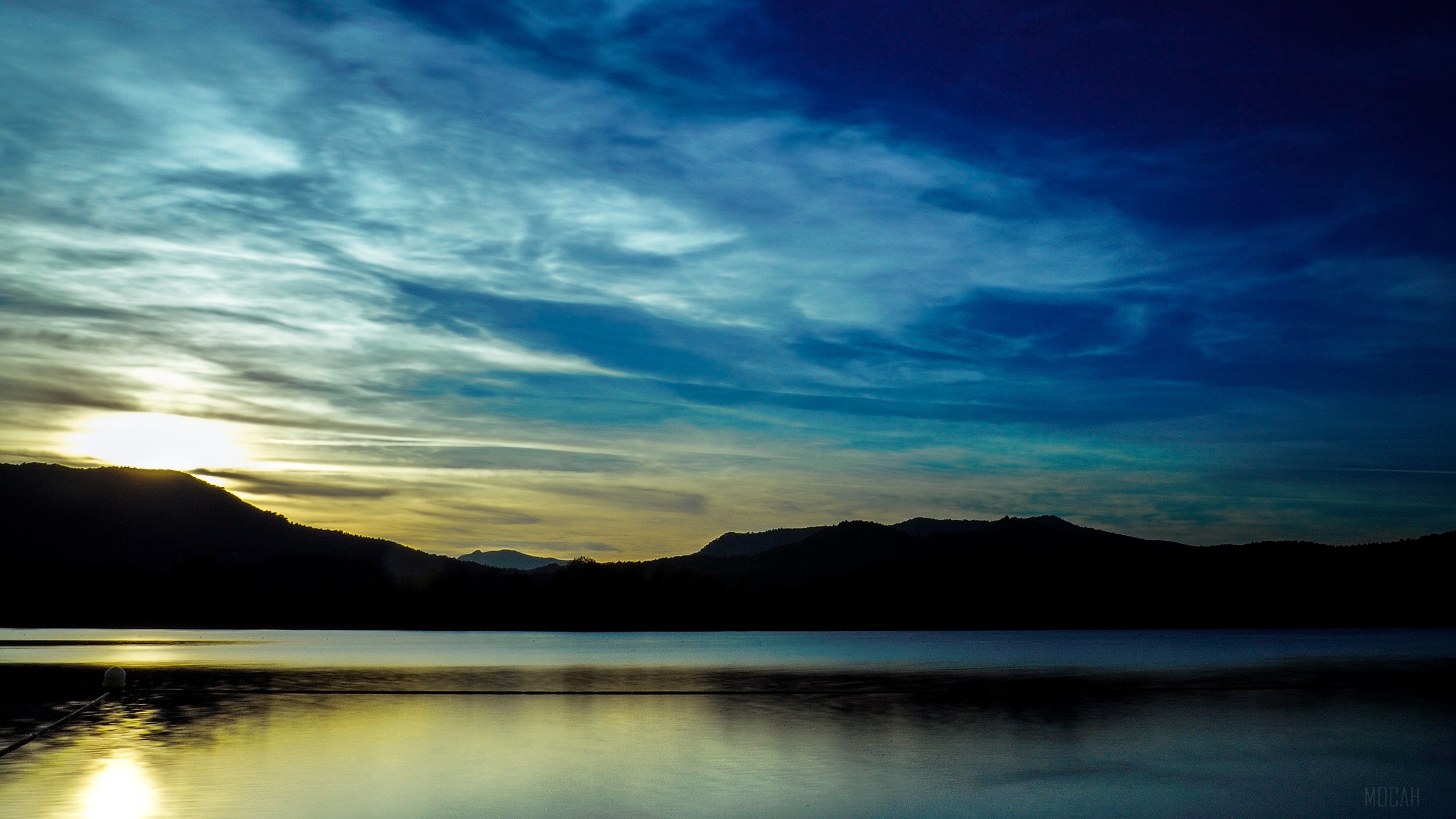 Sunset over a lake with mountains and clouds 4K HD Wallpaper