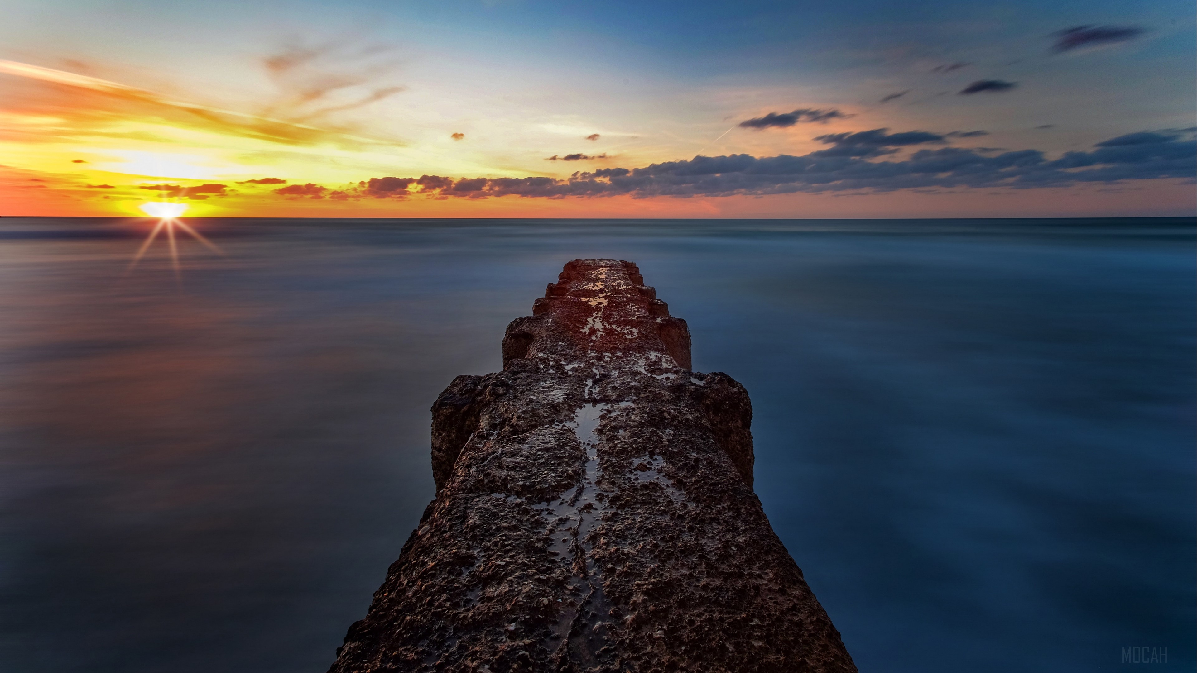 Breakwater at Sunset Over the Sea 4K HD Wallpaper