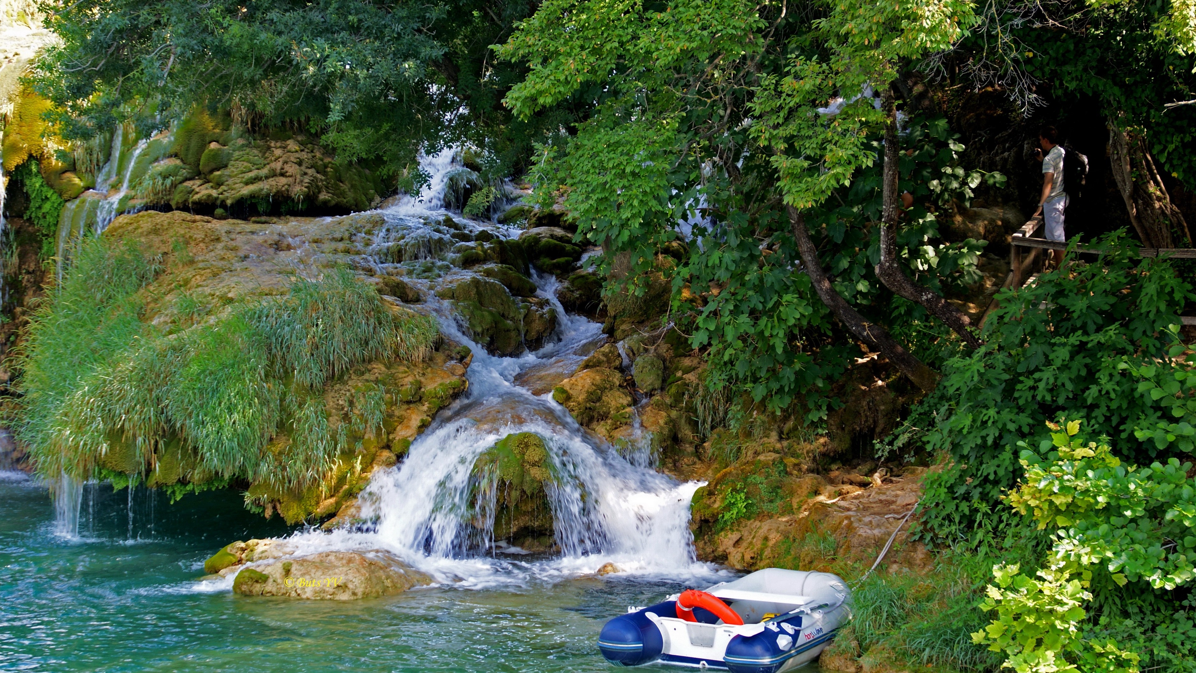 Boat near waterfalls in Croatia 4K HD Wallpaper
