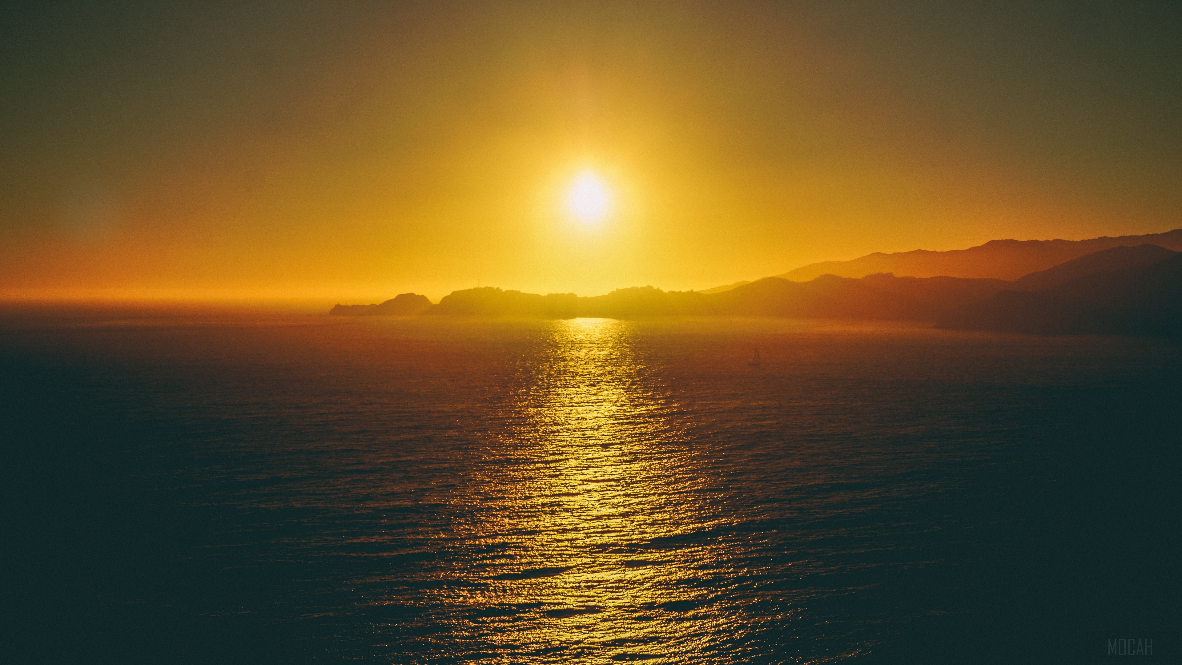 Sunset over the sea with mountains HD Wallpaper