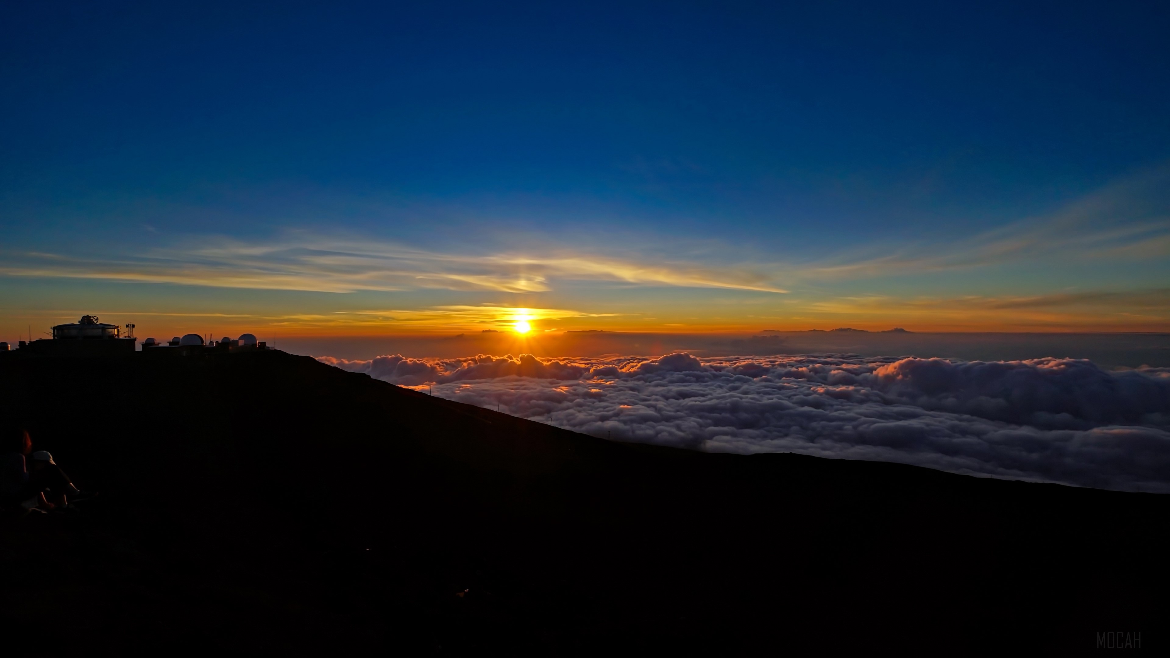 Sunset over clouds with observatories HD Wallpaper