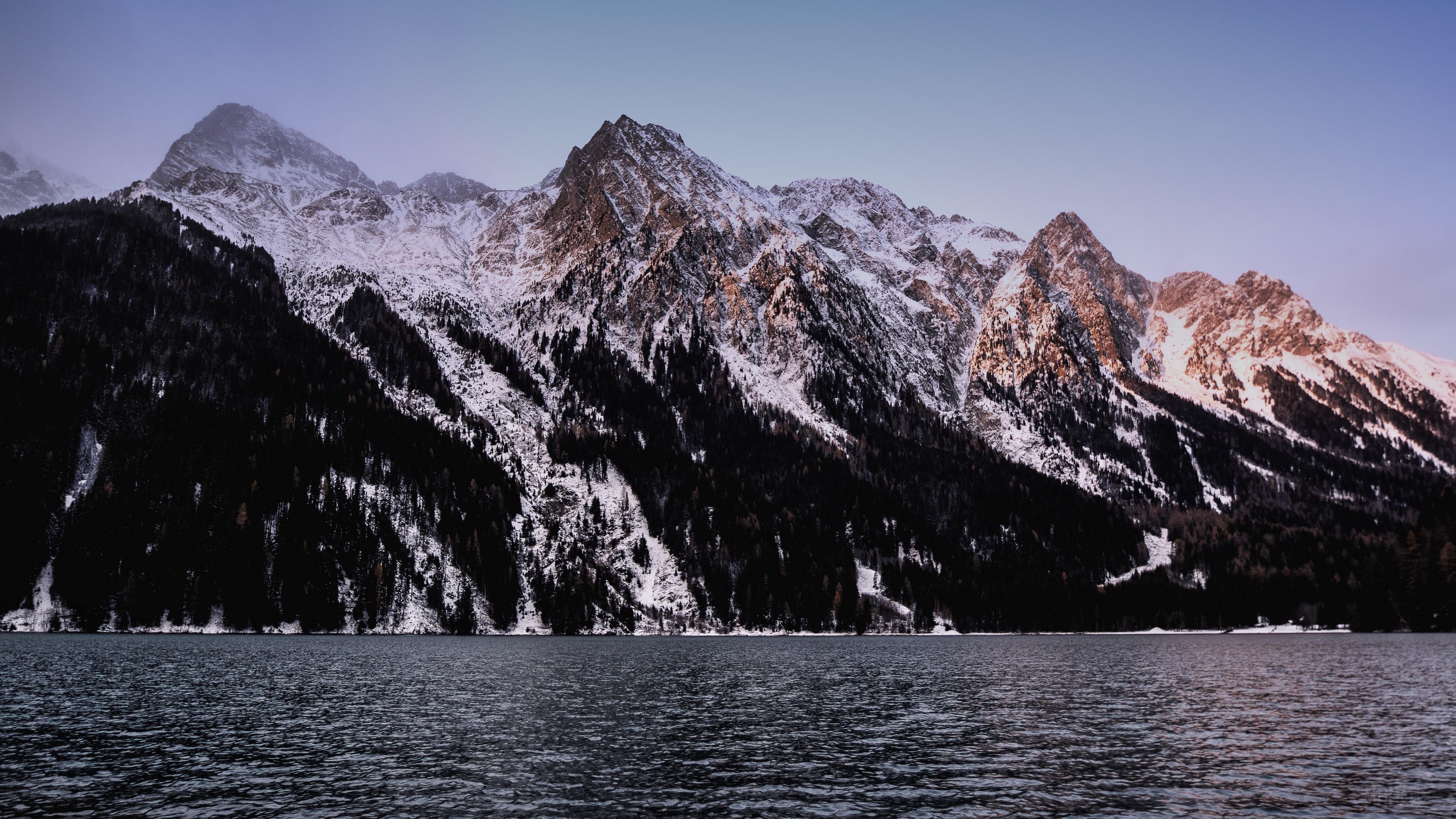 Snow-capped mountains over a lake HD Wallpaper