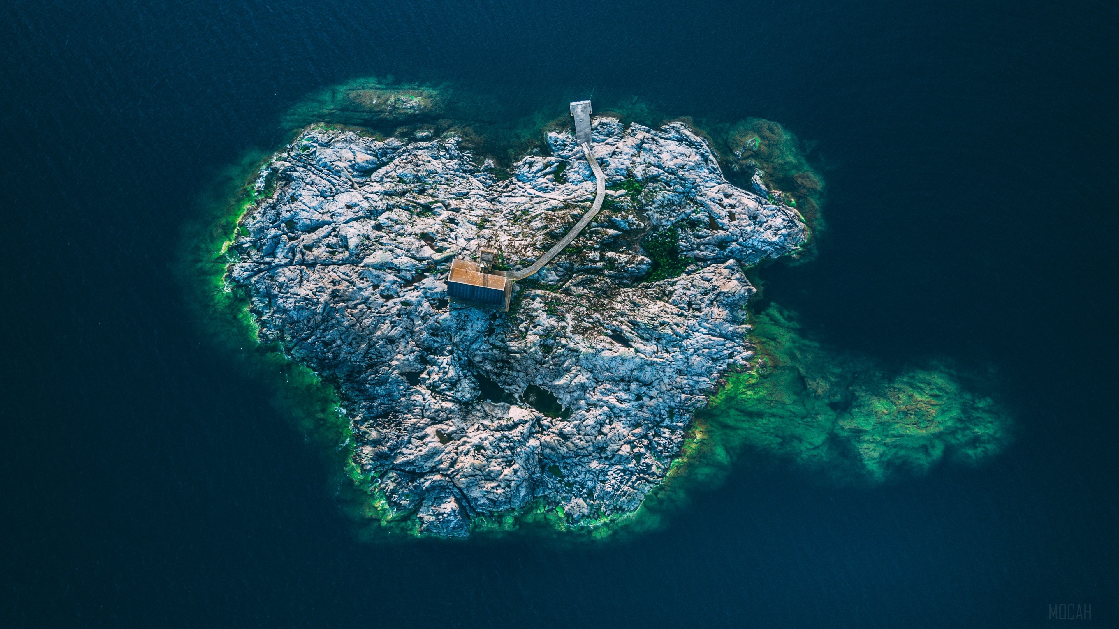 Aerial view of a small island with a cabin in Sweden HD Wallpaper