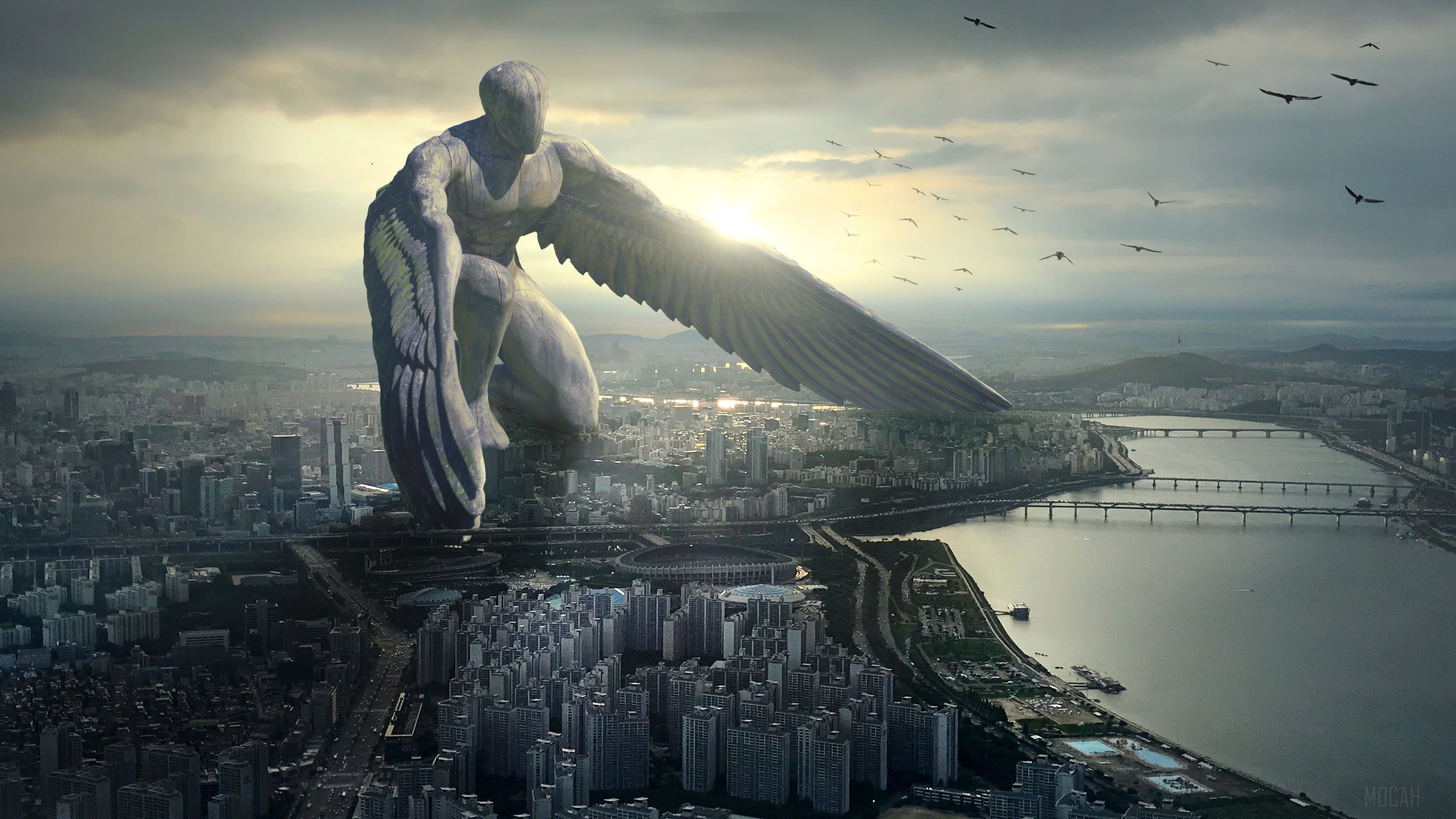Giant Angel statue overlooking a city HD Wallpaper