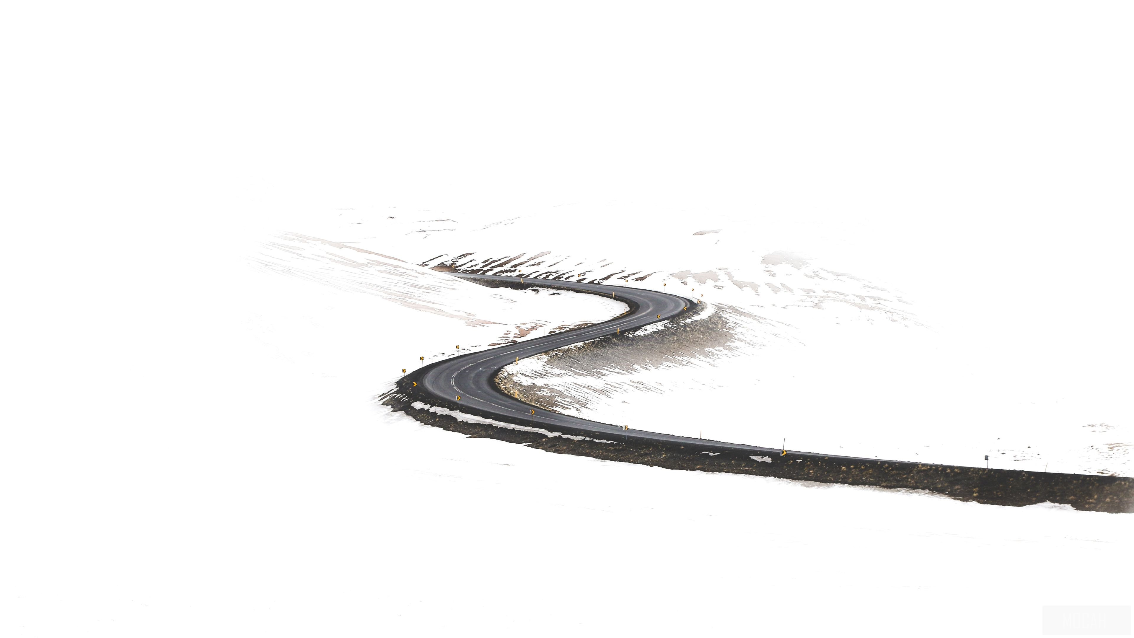 Winding Road Through Snowy Landscape 4K HD Wallpaper