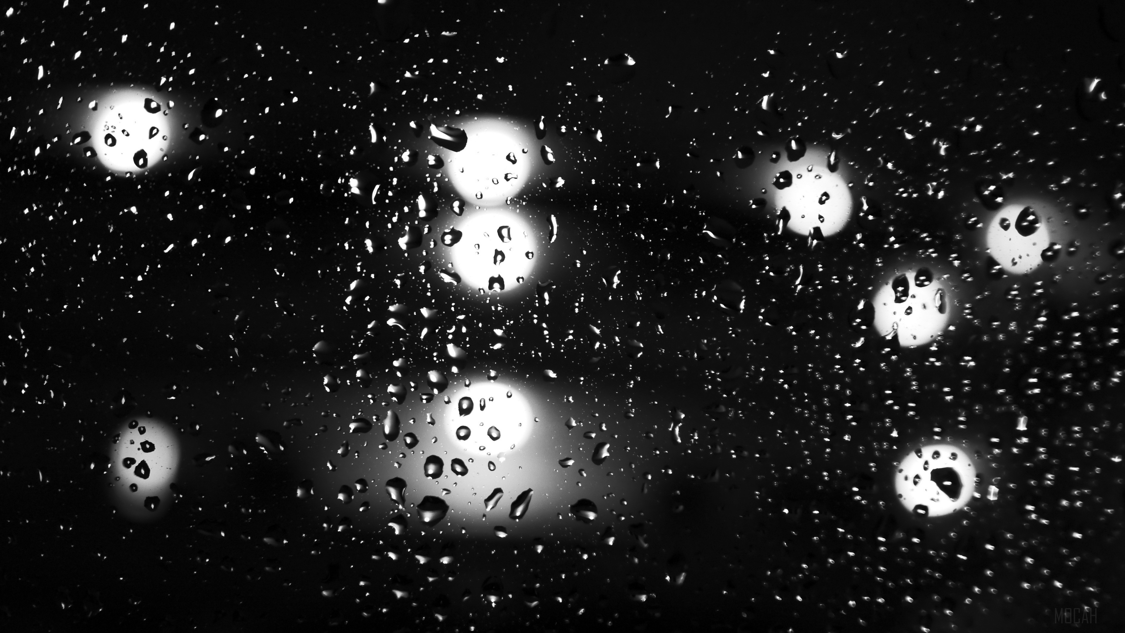 Raindrops on glass with bokeh lights 4K HD Wallpaper