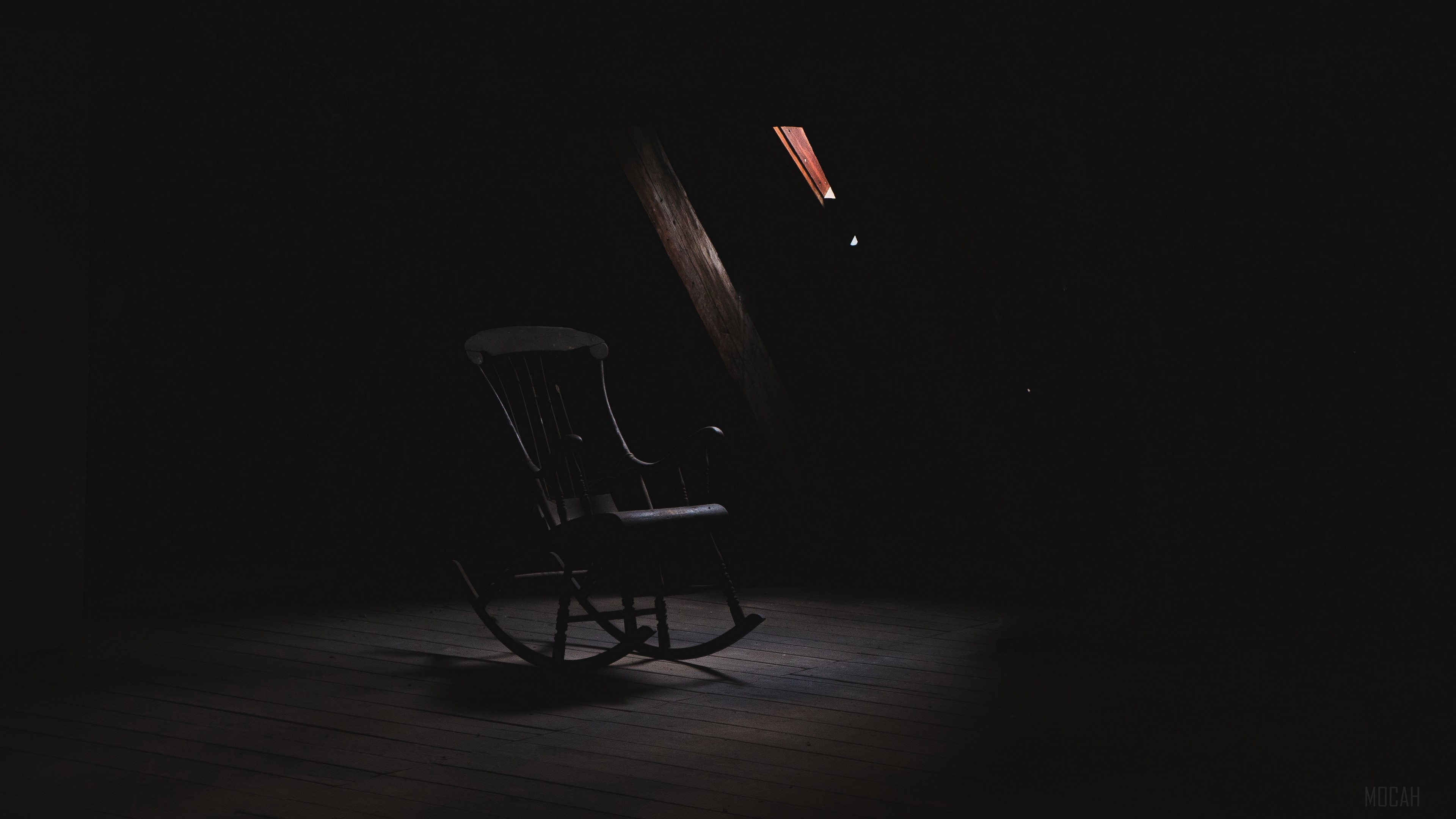 Rocking chair in a dark loft 4K HD Wallpaper