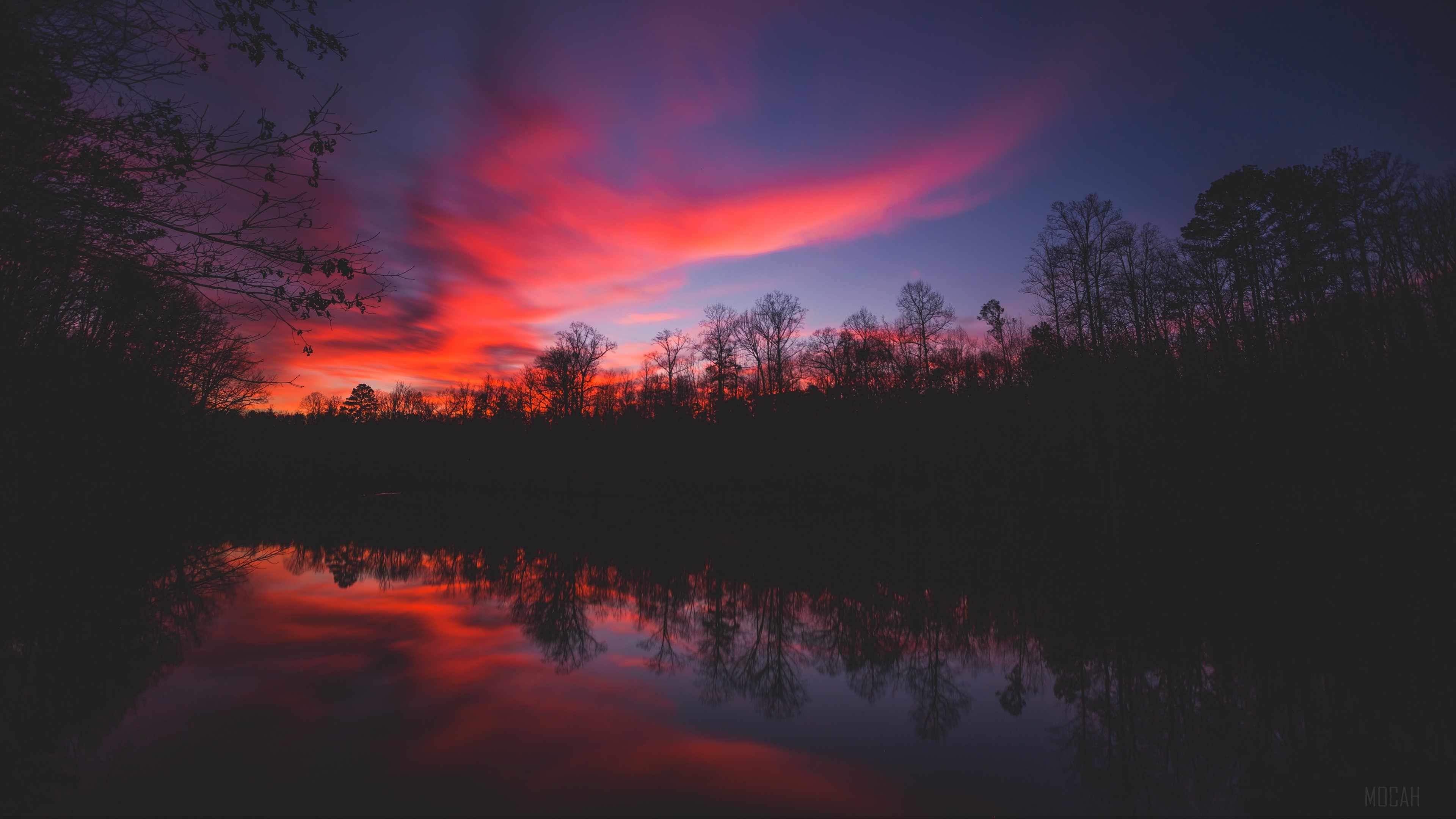 Sunset over a lake with tree reflections 4K HD Wallpaper