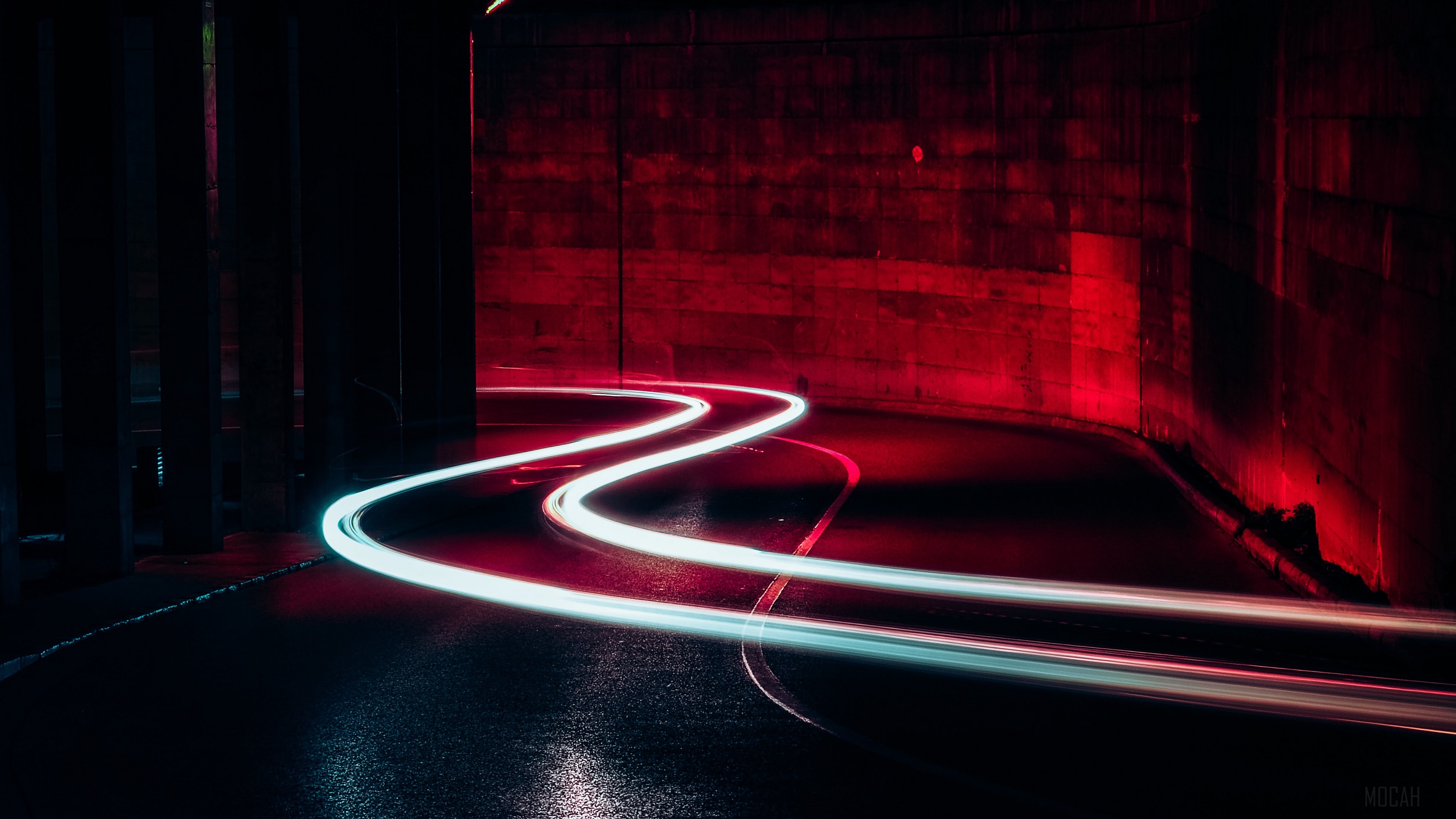 Light trails on a wet road in a tunnel HD Wallpaper