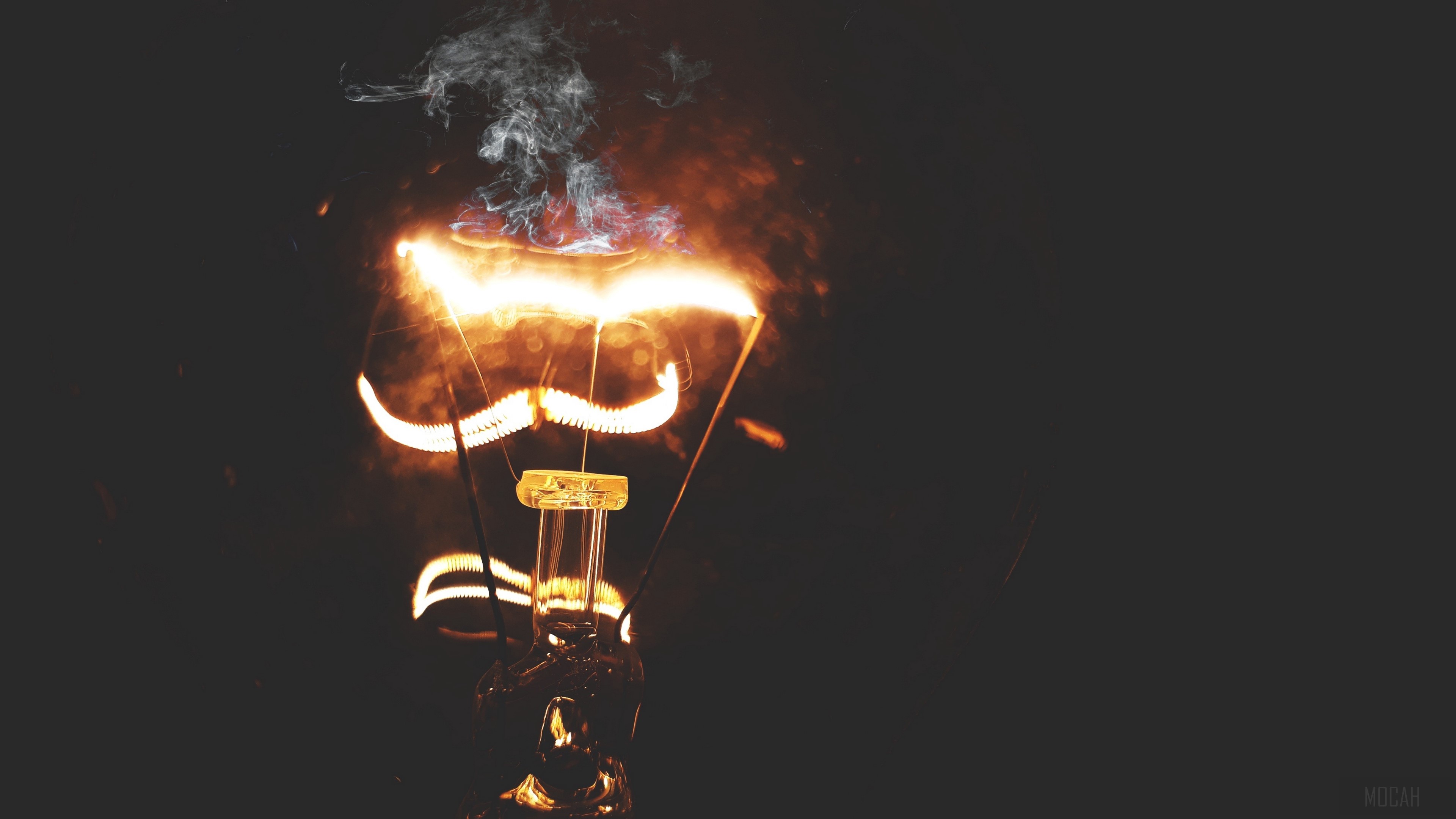 Burning light bulb with smoke 4K HD Wallpaper