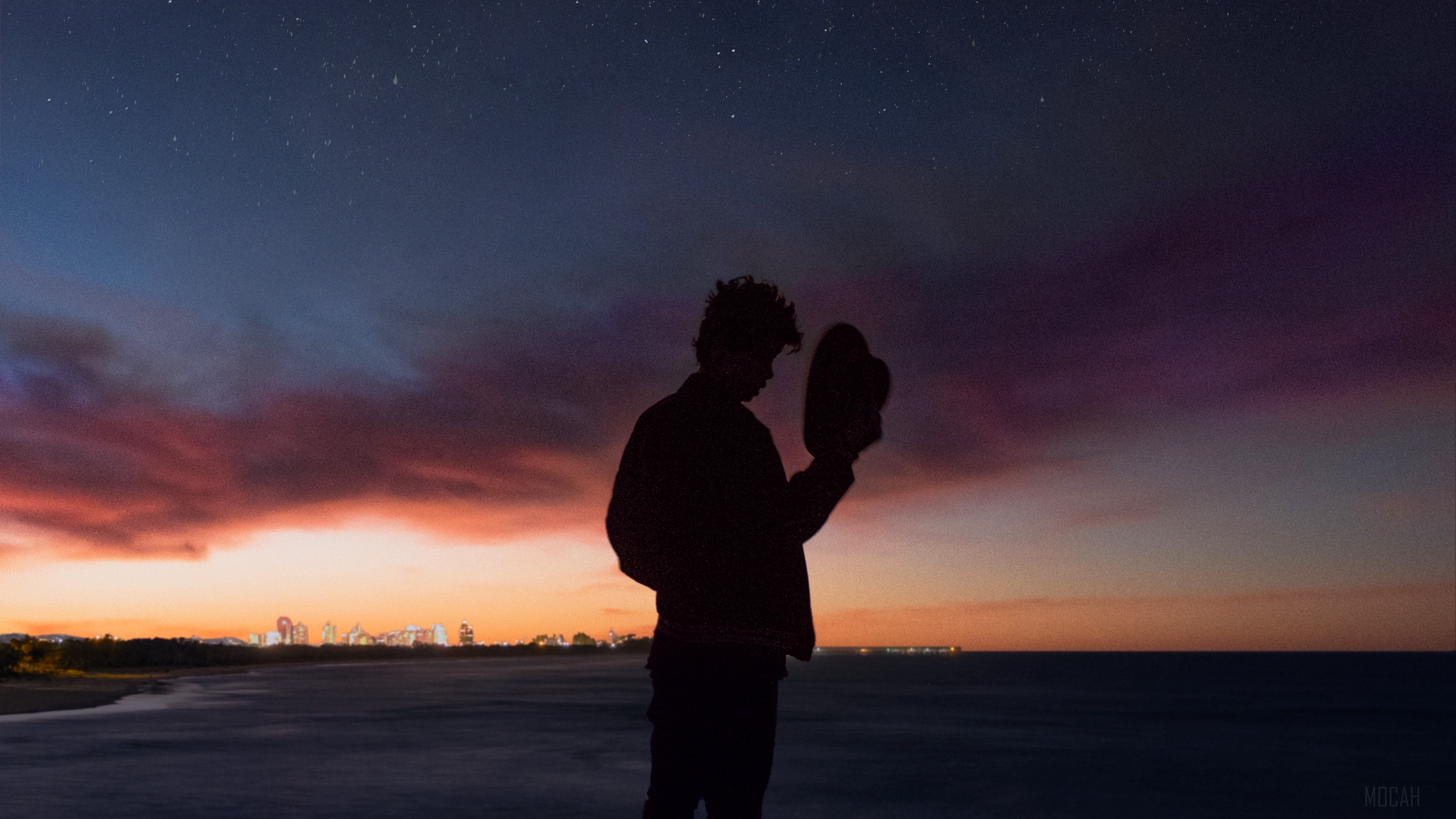Silhouette of a person holding a hat against a starry sky and sunset HD Wallpaper