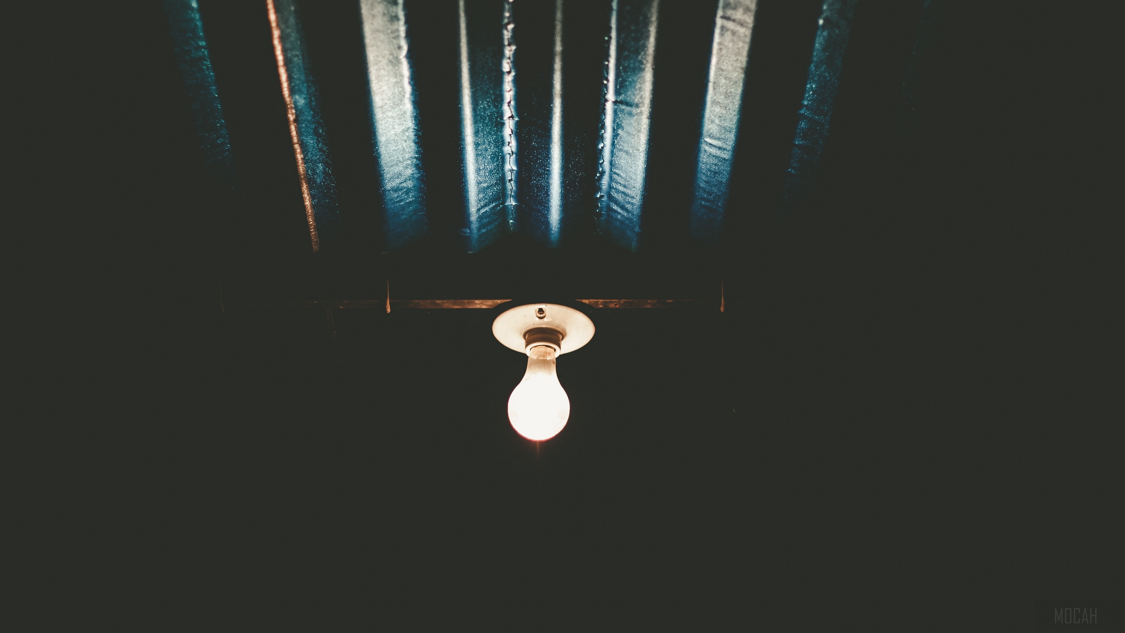 Light bulb hanging from ceiling HD Wallpaper