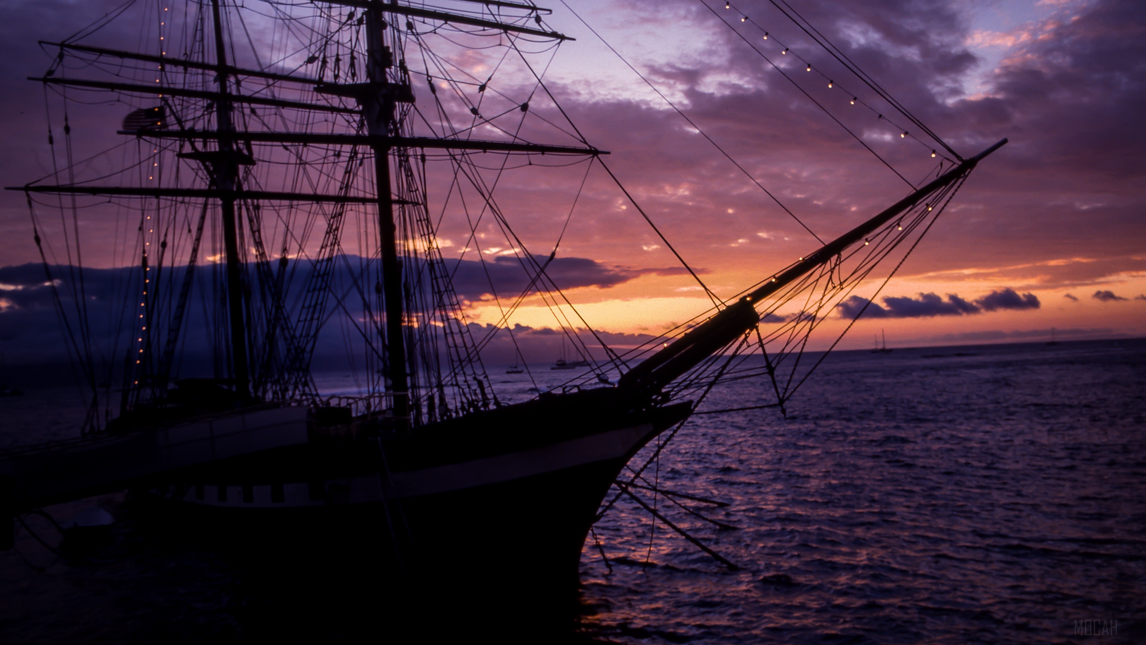 Silhouette of a tall ship at sunset over the sea 4K HD Wallpaper
