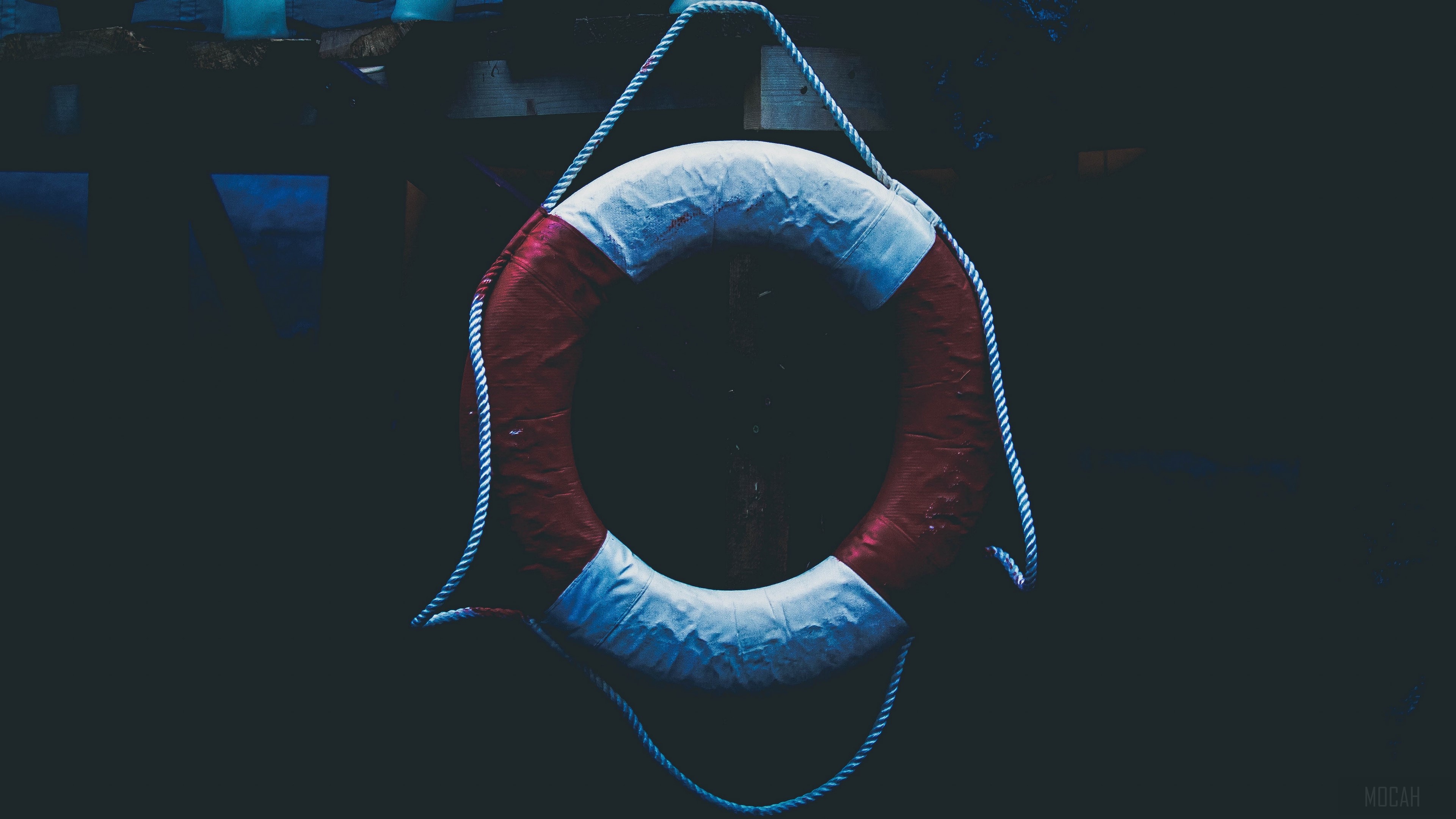 Lifebuoy hanging on a rope HD Wallpaper