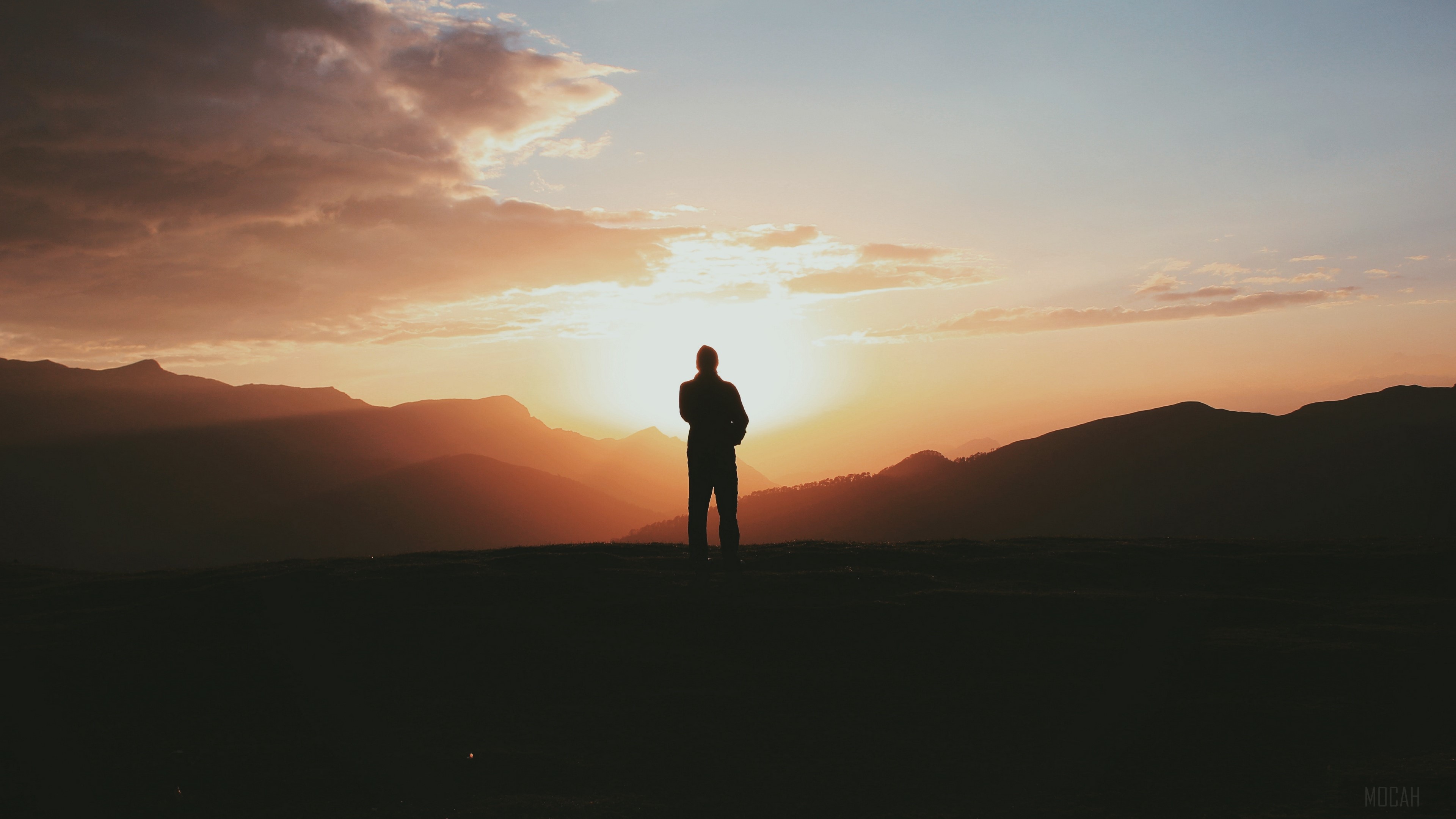 Man silhouette on mountain at sunset 4K HD Wallpaper
