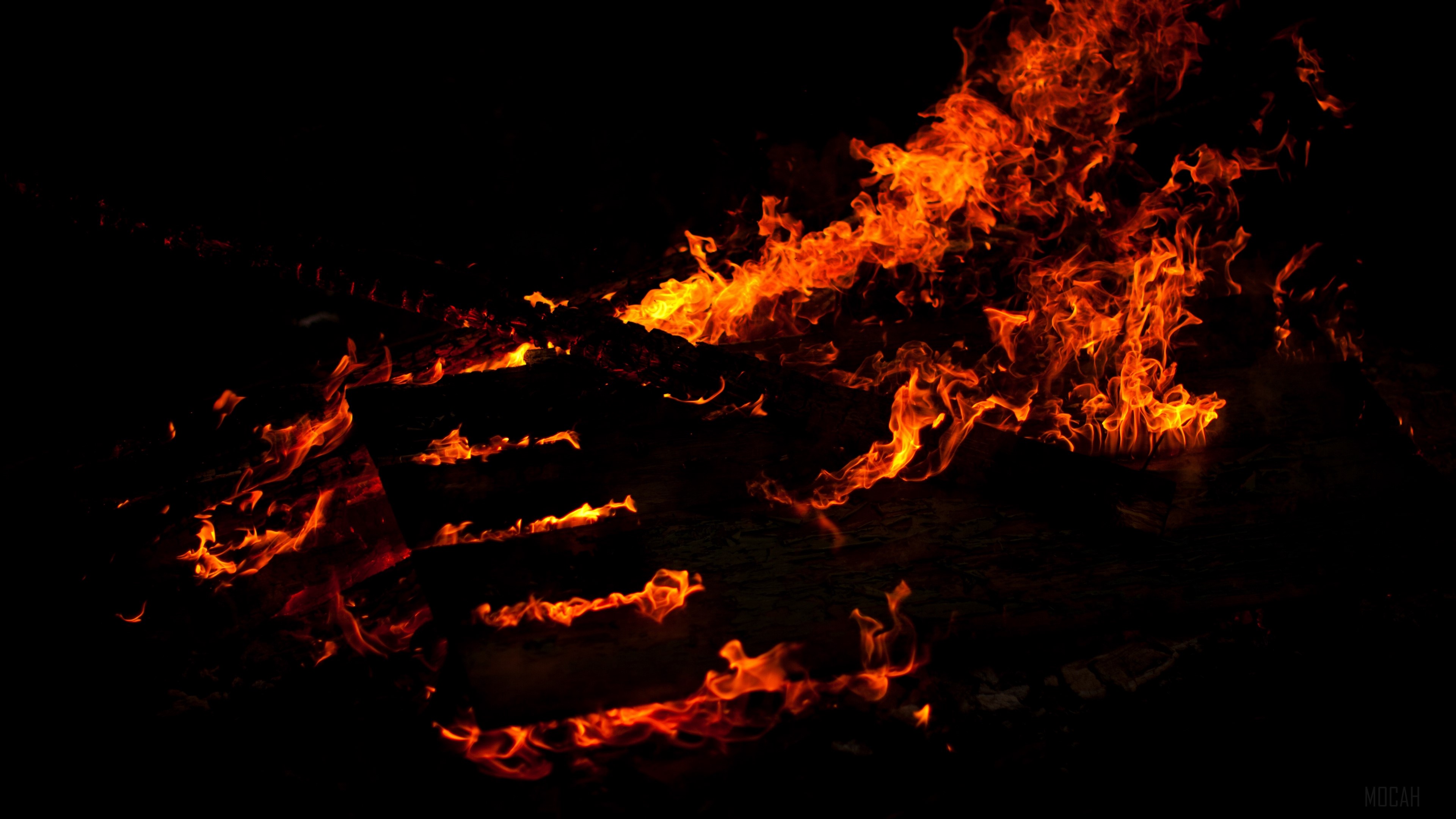 Fire burning on a black background 4K HD Wallpaper