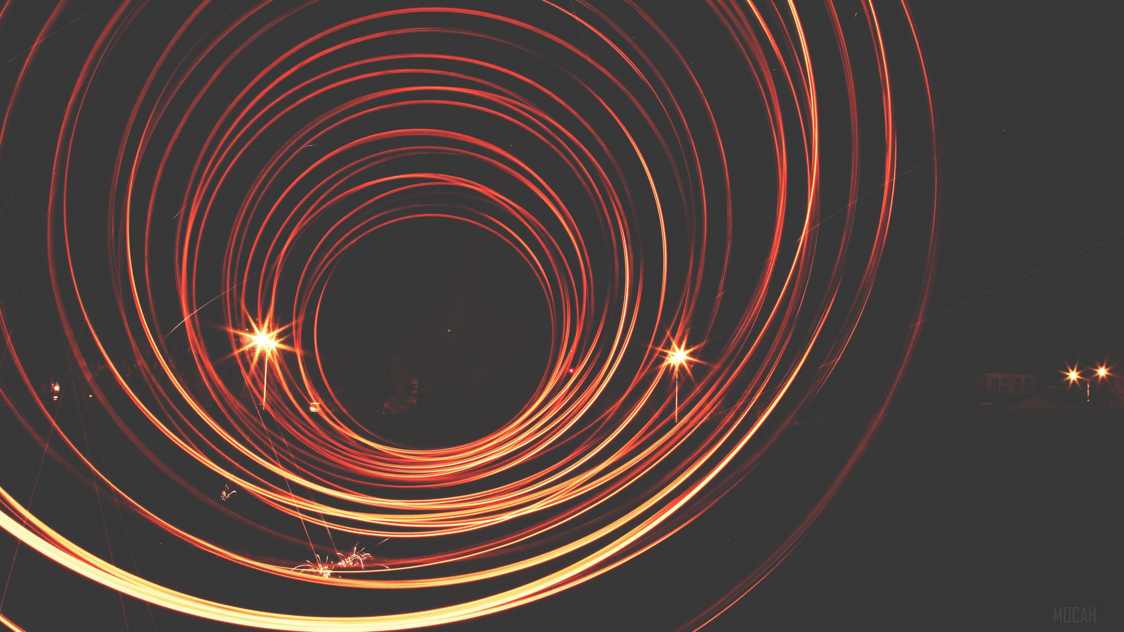 Light painting circles with sparks and distant lights HD Wallpaper