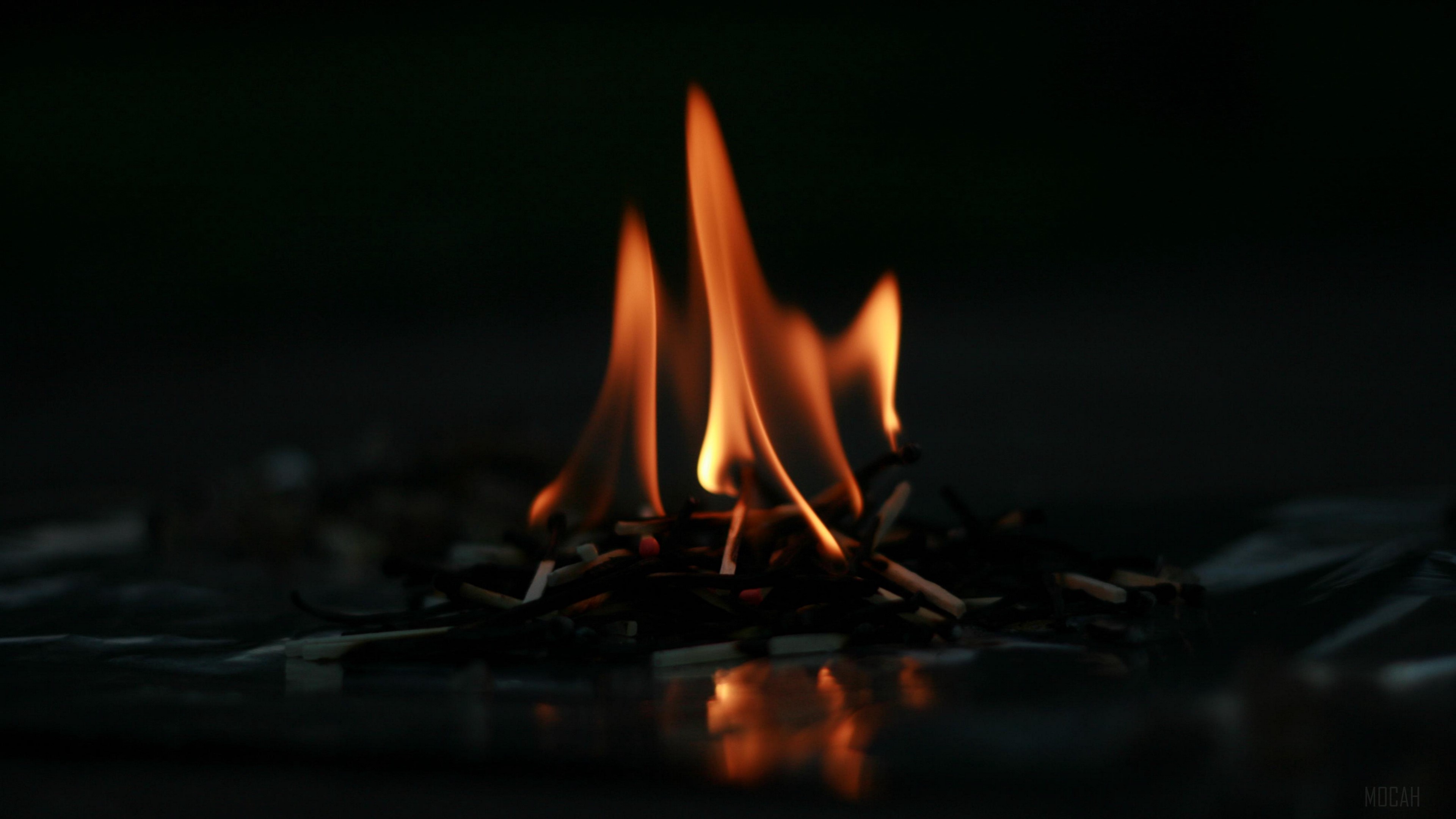 Pile of burning matches in 4K HD Wallpaper