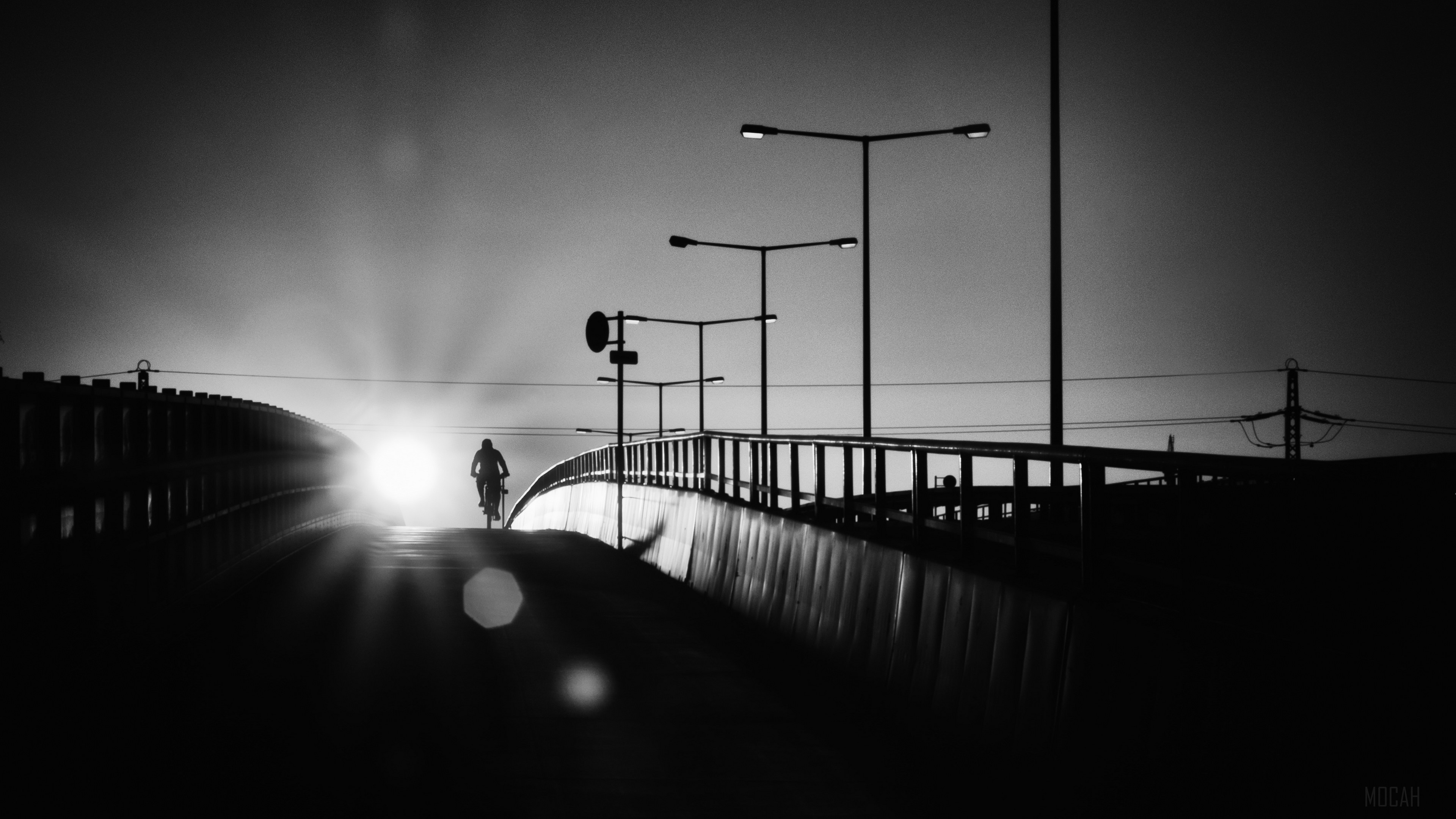 Bicyclist on a bridge at sunset, black and white HD Wallpaper