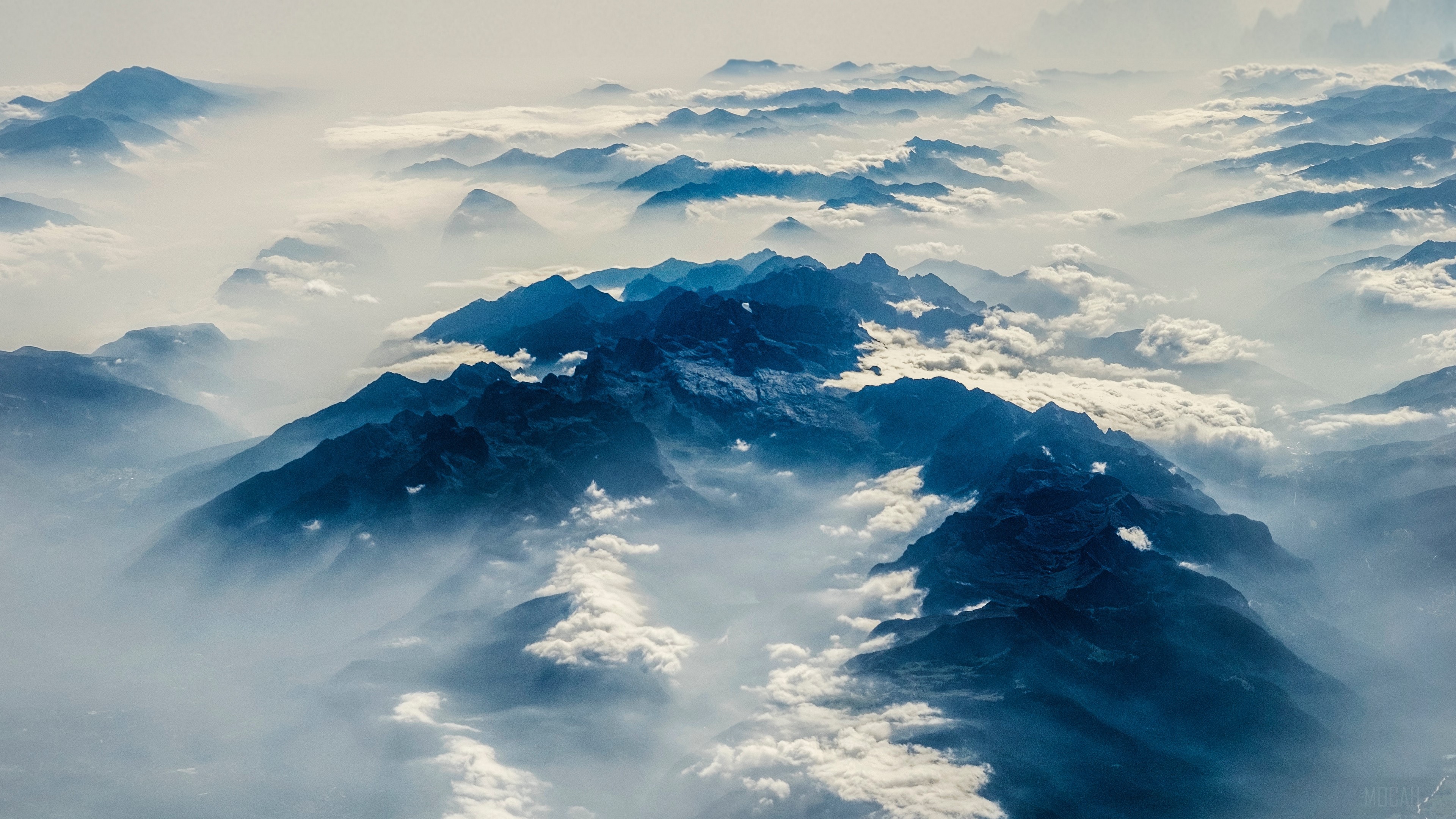 Aerial view of misty mountains in the Alps 4K HD Wallpaper