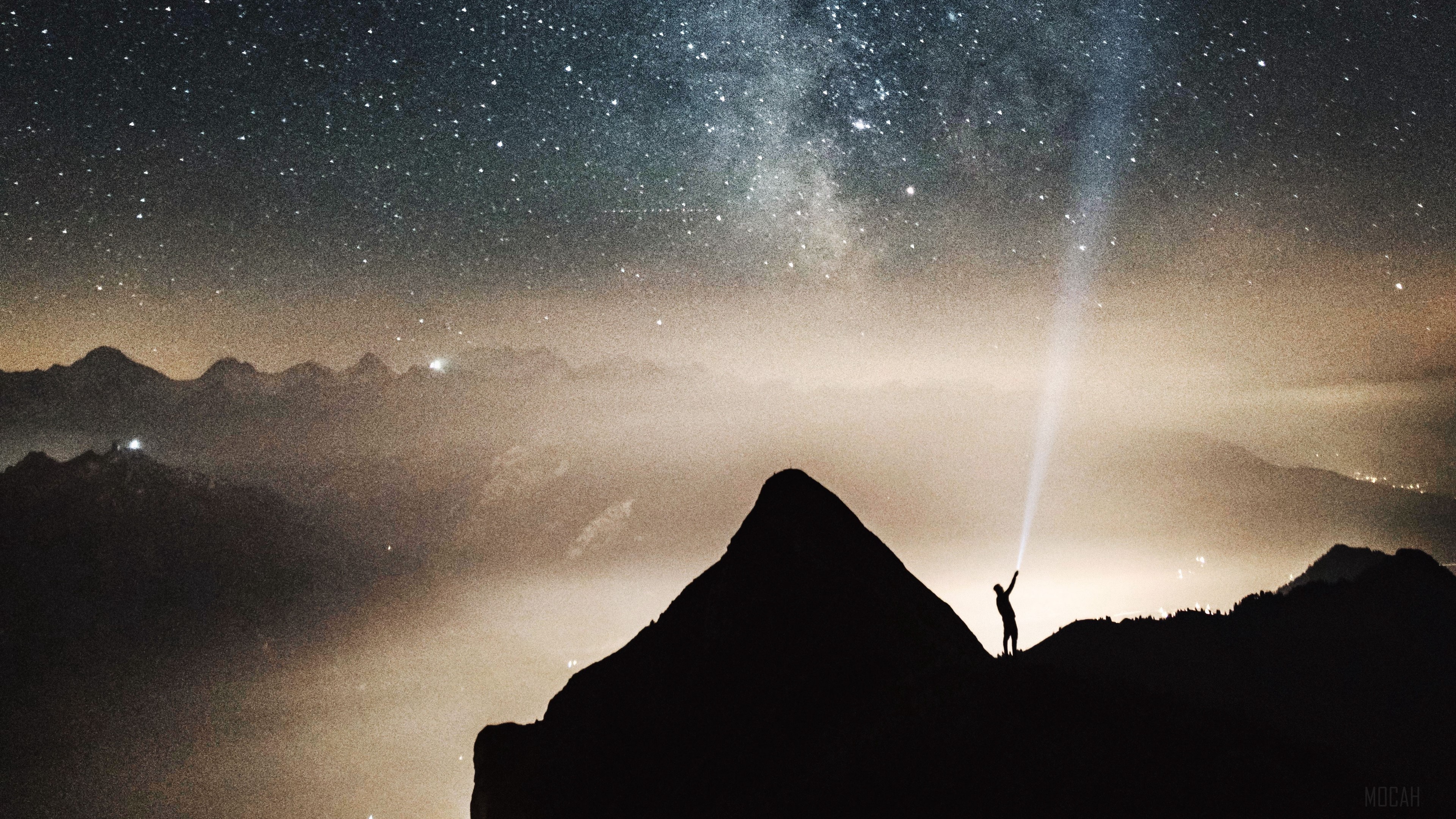 Silhouette with flashlight under starry sky and mountains 4K HD Wallpaper