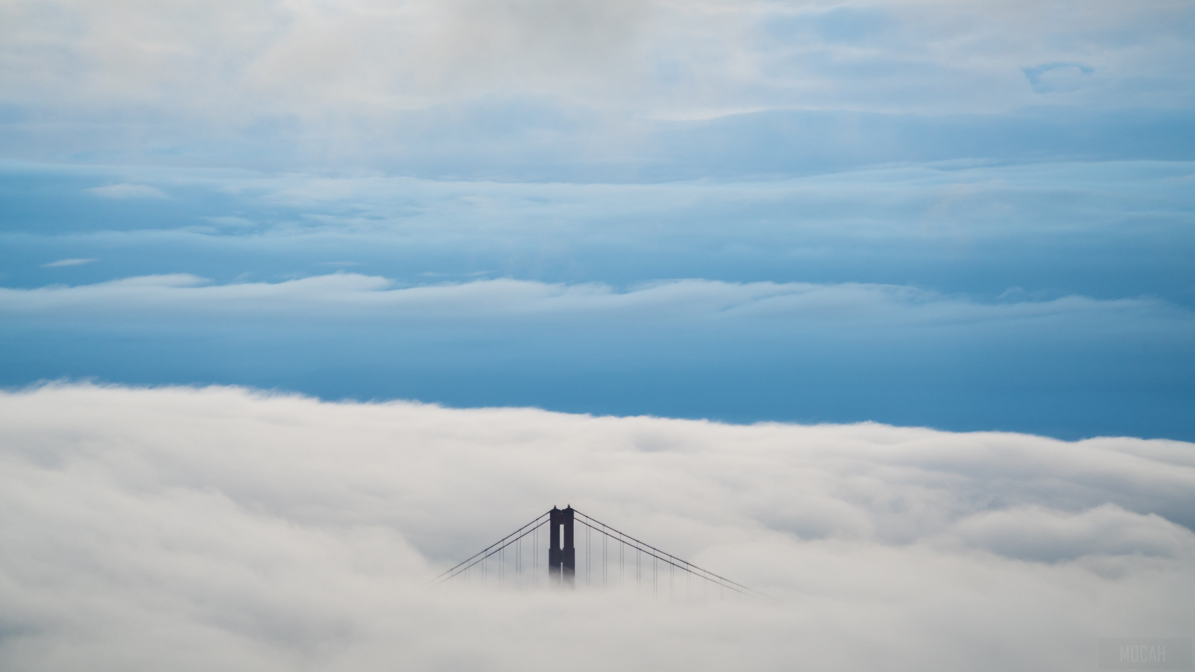 Golden Gate Bridge partially submerged in fog HD Wallpaper